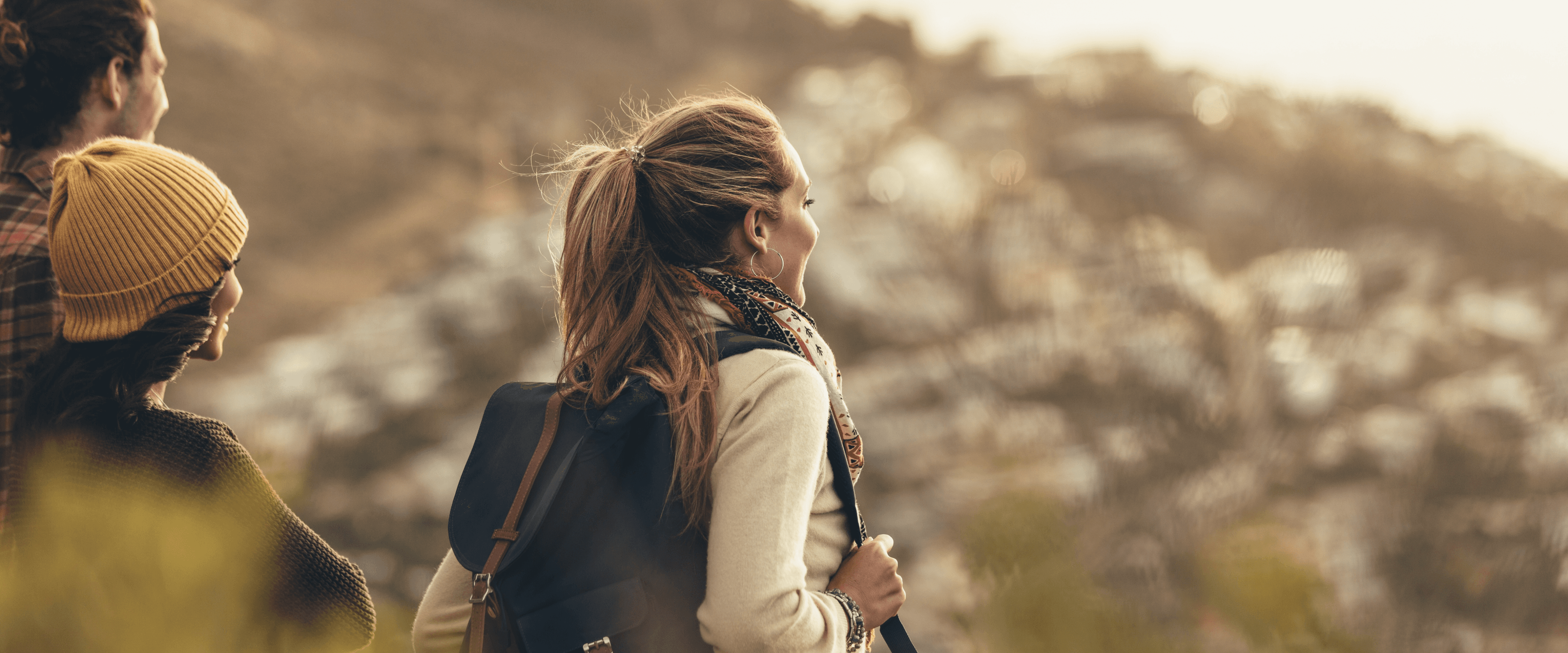 group hiking nature mountains female with backpack