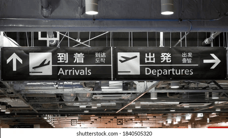a group of people standing around a train station