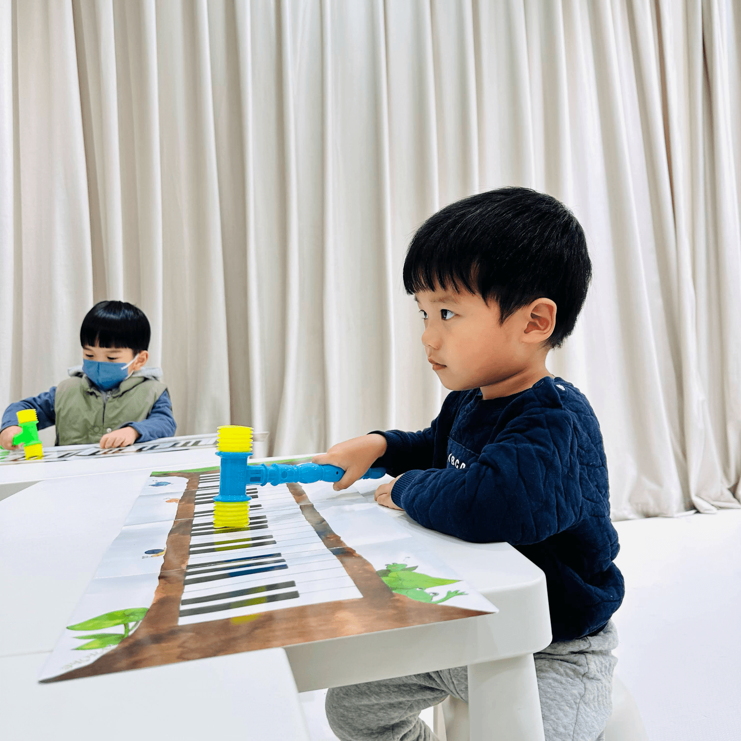 Minimalist abstract image of a stylized turquoise hand gesture on a dark background