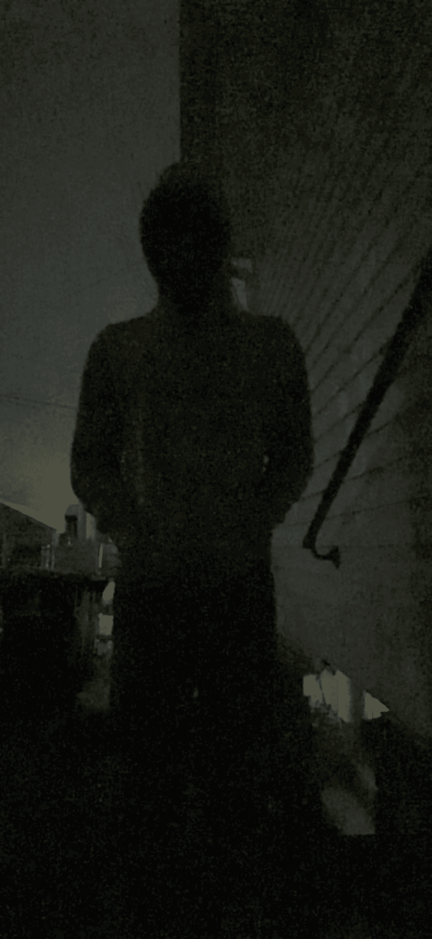 An album cover of a shadowy figure.