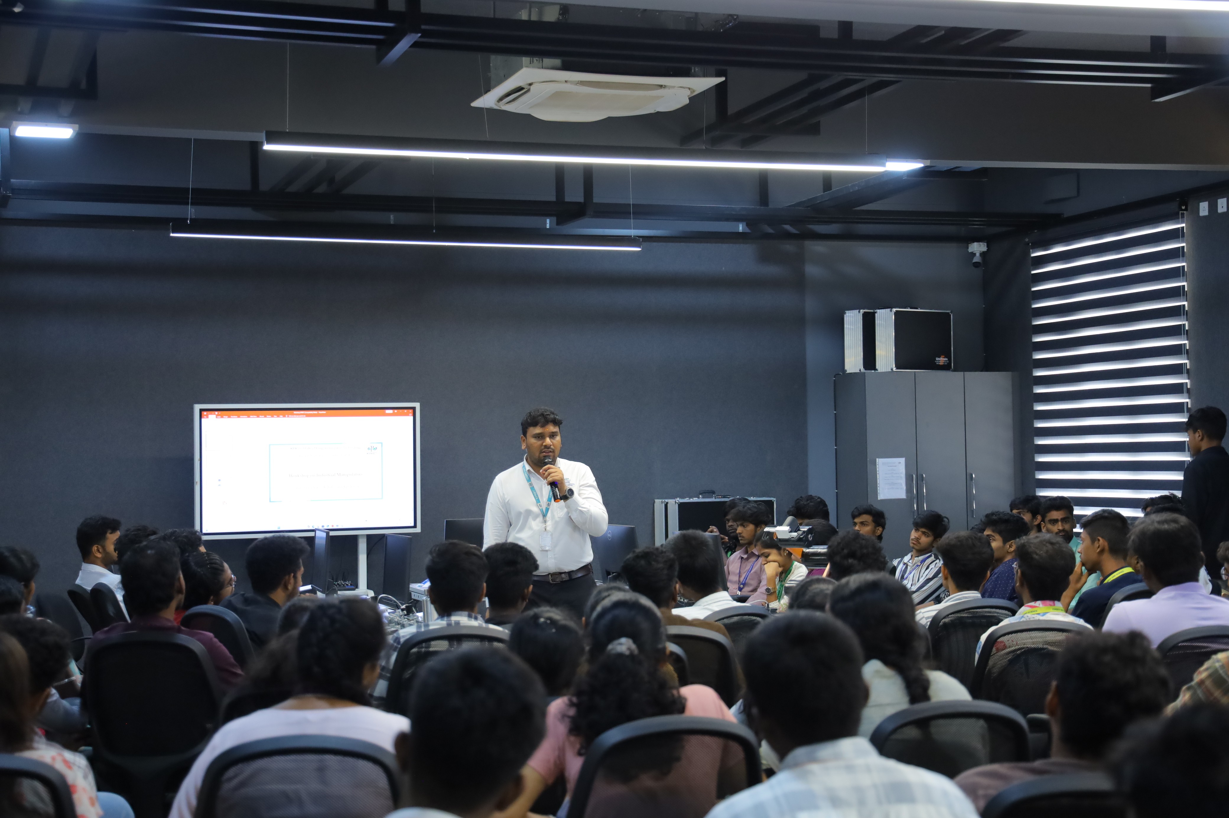 a group of people standing around a table