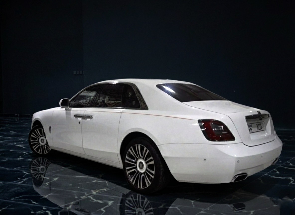 Rolls-Royce Ghost 2023 white rear exterior luxury sedan with V12 engine for premium car rental in Dubai
