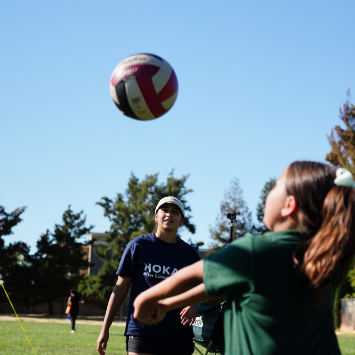 Elementary students playing volleyball during a HOKALI after-school sports program