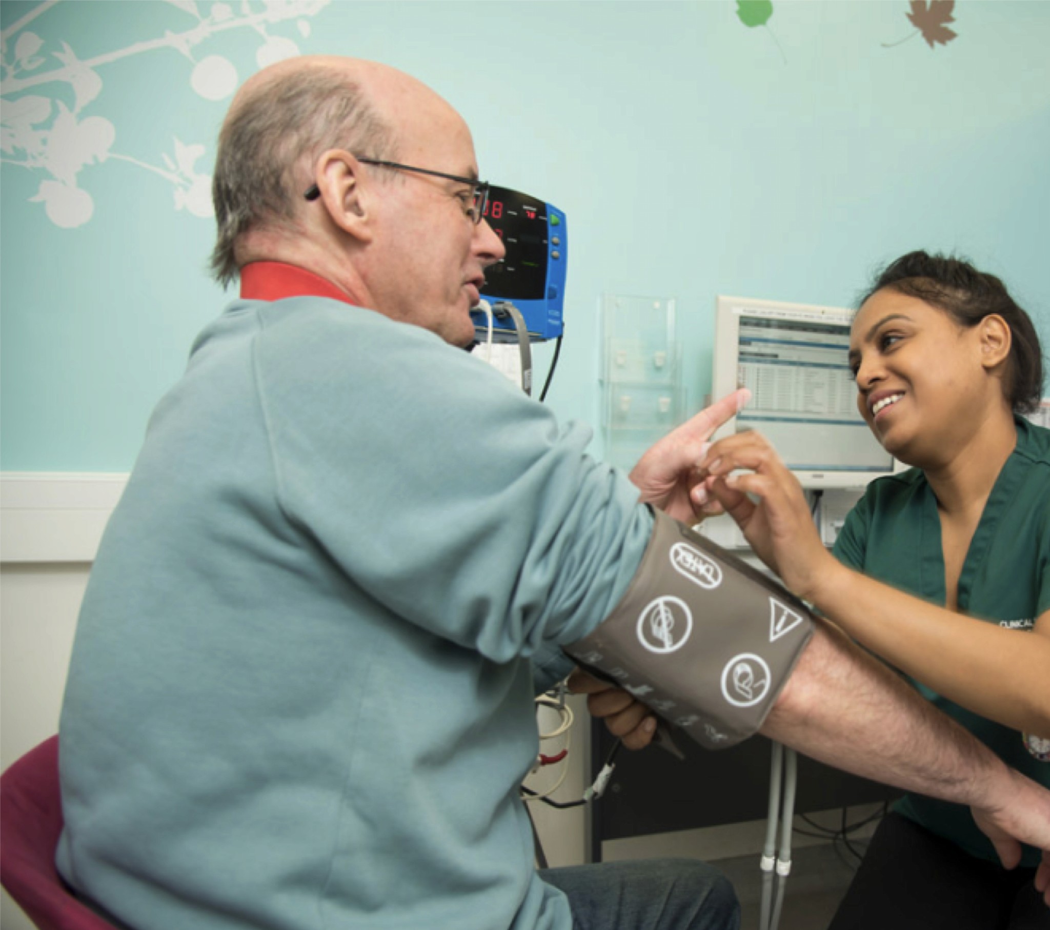 a nurse taking someone's blood pressure