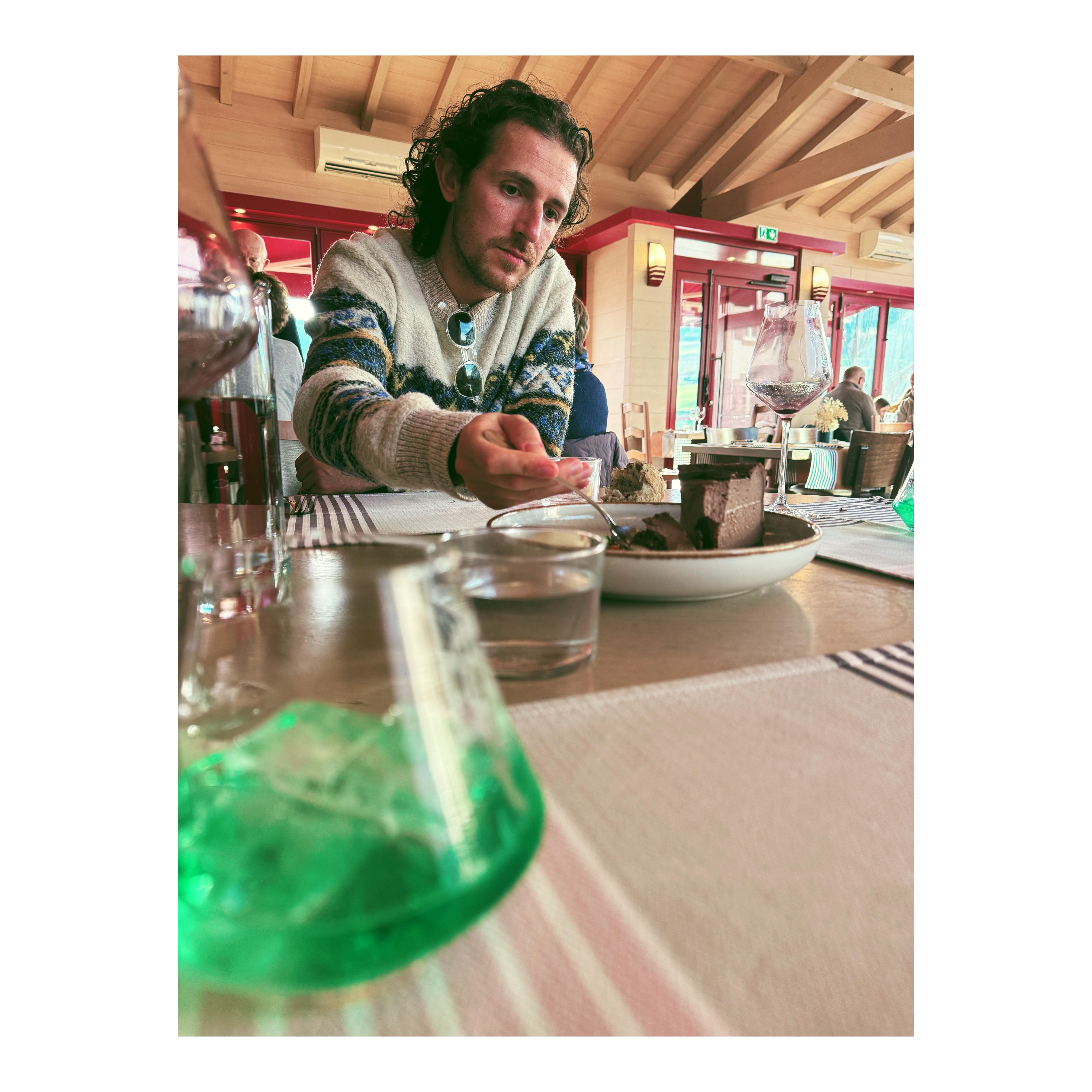 A bunch of dried red chili peppers hanging outside a store.