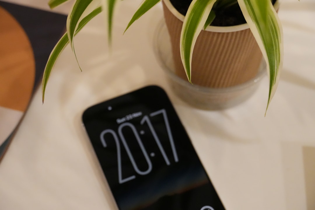 Smartphone displaying the time 20:17 on a table.