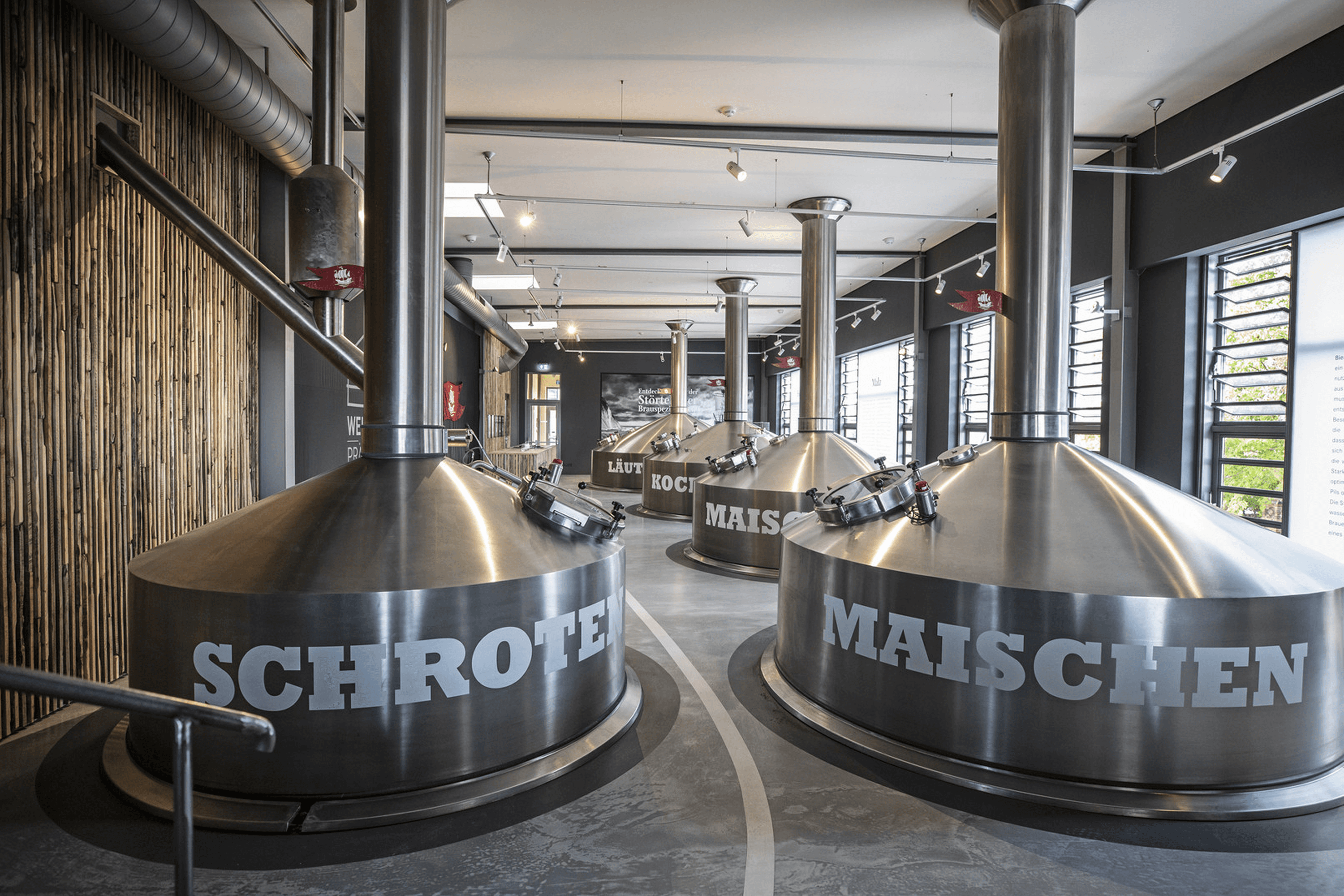 Industrial vats labeled "Schroten" and "Maisschen"