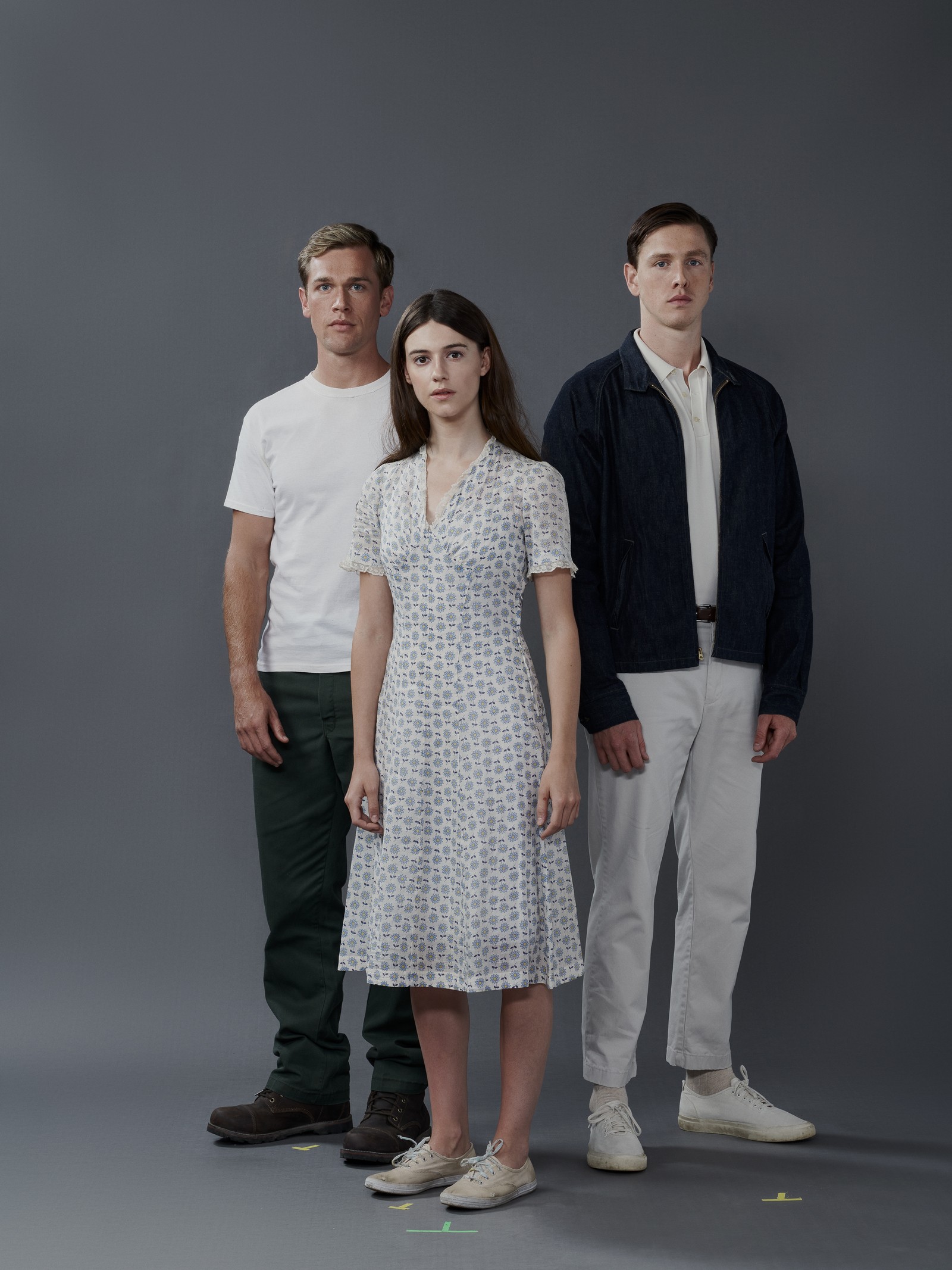 Portrait of actress Daisy Edgar-Jones, actor Taylor John Smith and actor Harris Dickinson made during the photography gallery and key art shoot for feature film where the crawdads sing. Daisy Edgar-Jones is portraying the character of Kia, Taylor John Smith is portraying Tate and Harris Dickinson is portraying Chase. They all stand together. 