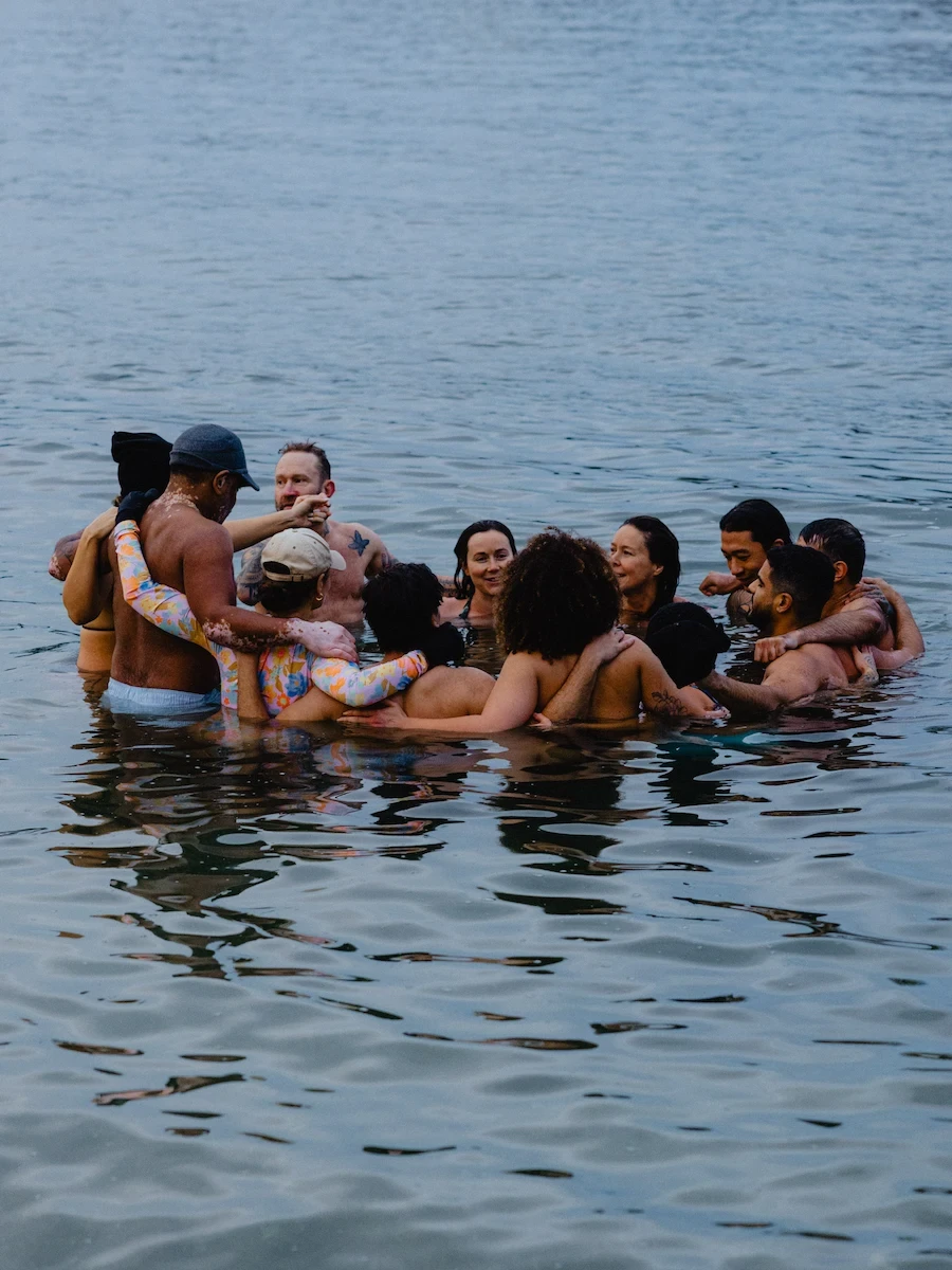 Community cold plunge session supporting contrast therapy benefits like stress reduction and connection.