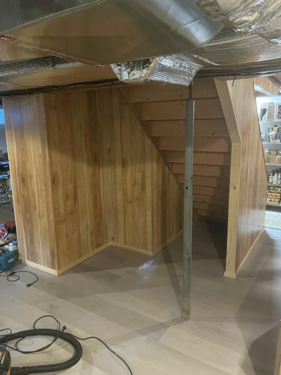 Finished basement floor with new flooring installed
