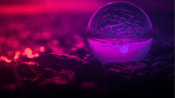 a transparent sphere showing the inverted reflection of a landscape (Photo by Paul Basel)