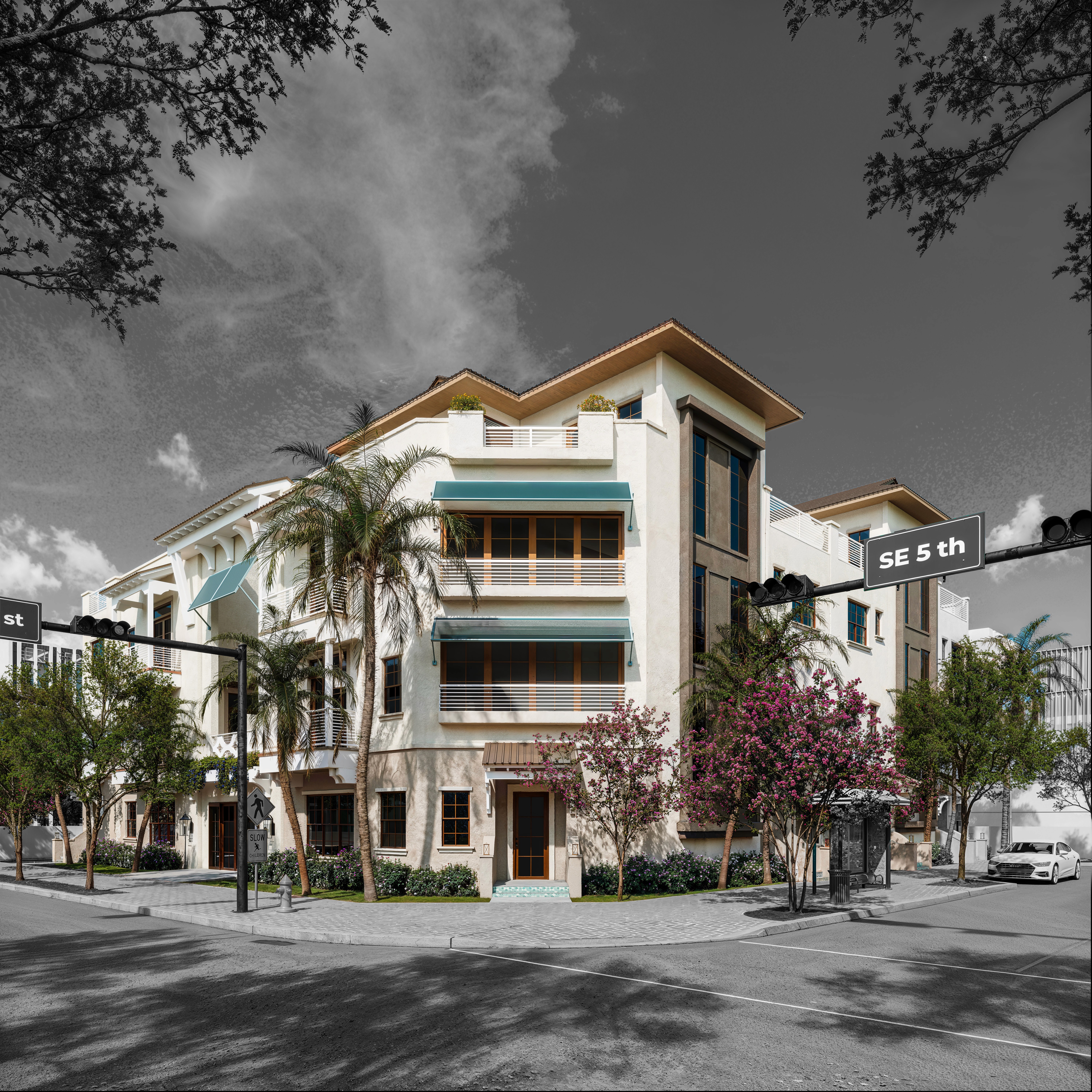 Color-splash street view of a modern three-story corner apartment building with teal awnings, balconies, palms, and flowering trees.