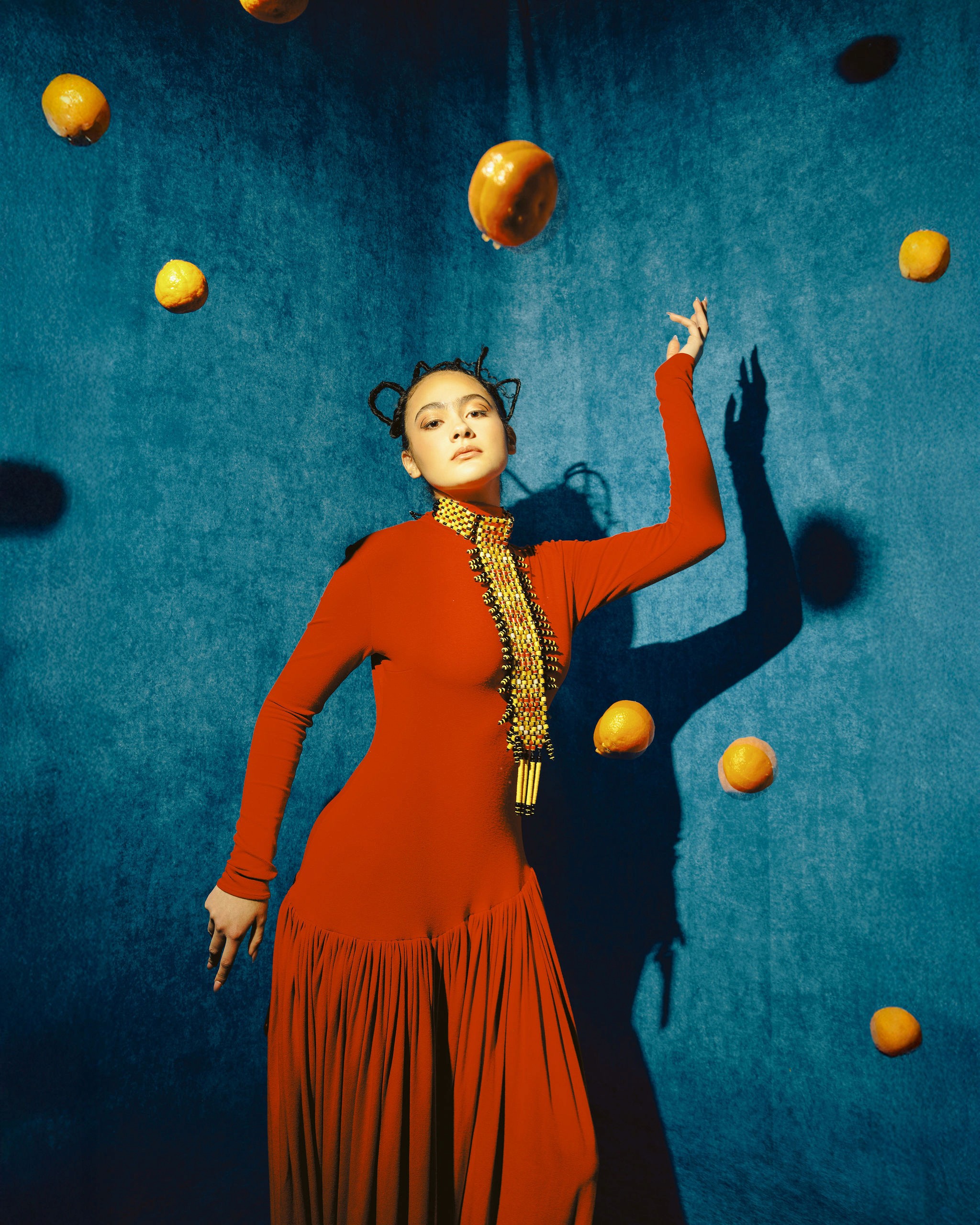 Woman with red hair covering mouth with hair