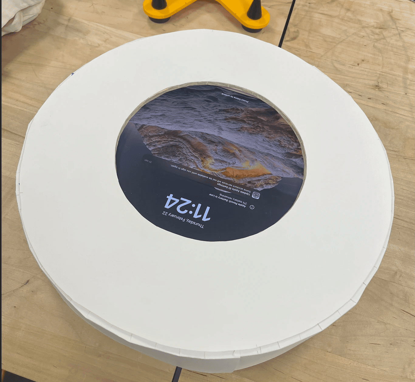 a black cellphone with a white letter on it