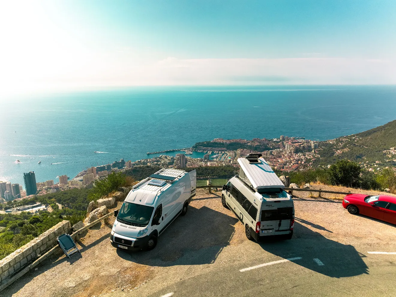 A chef placing fried chicken in a take away box