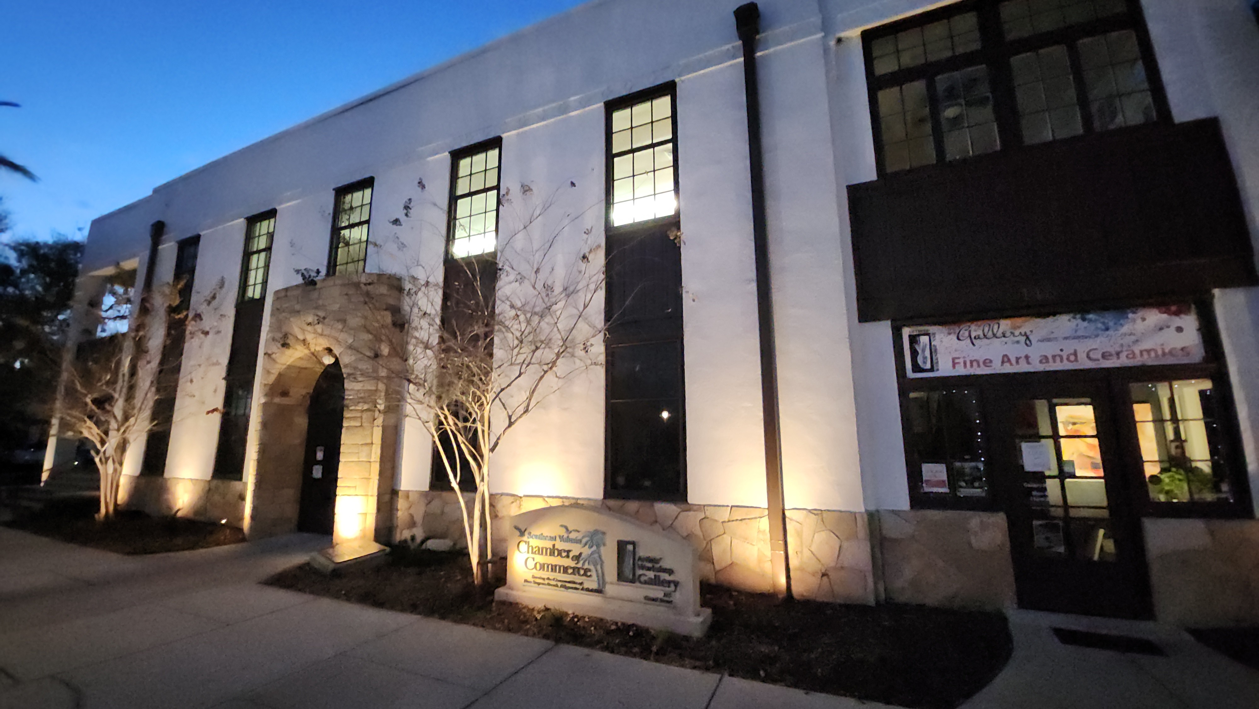 Commercial architectural lighting illuminating Chamber of Commerce building exterior