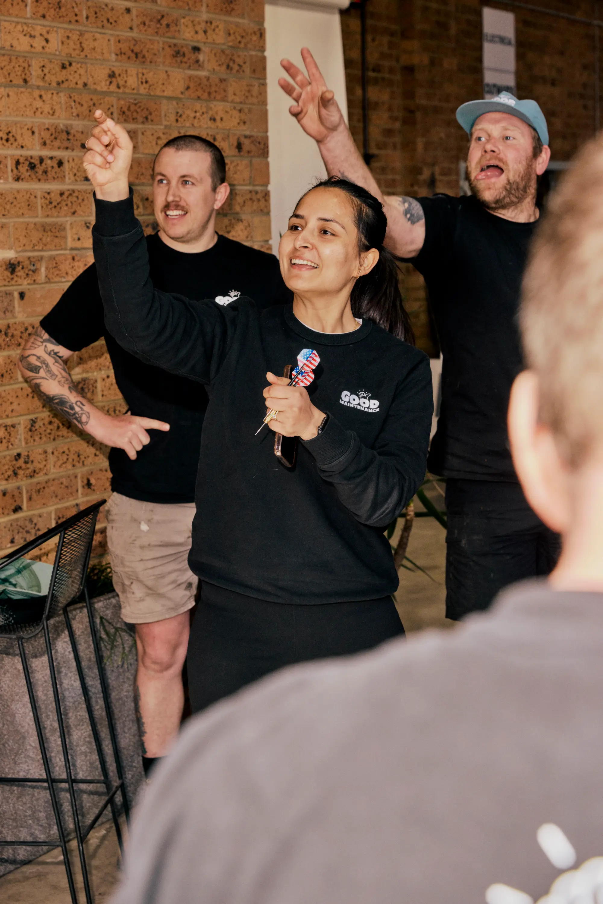 Team Members playing darts