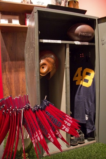 football red flags, blue jersey with number 48 and a rugby ball