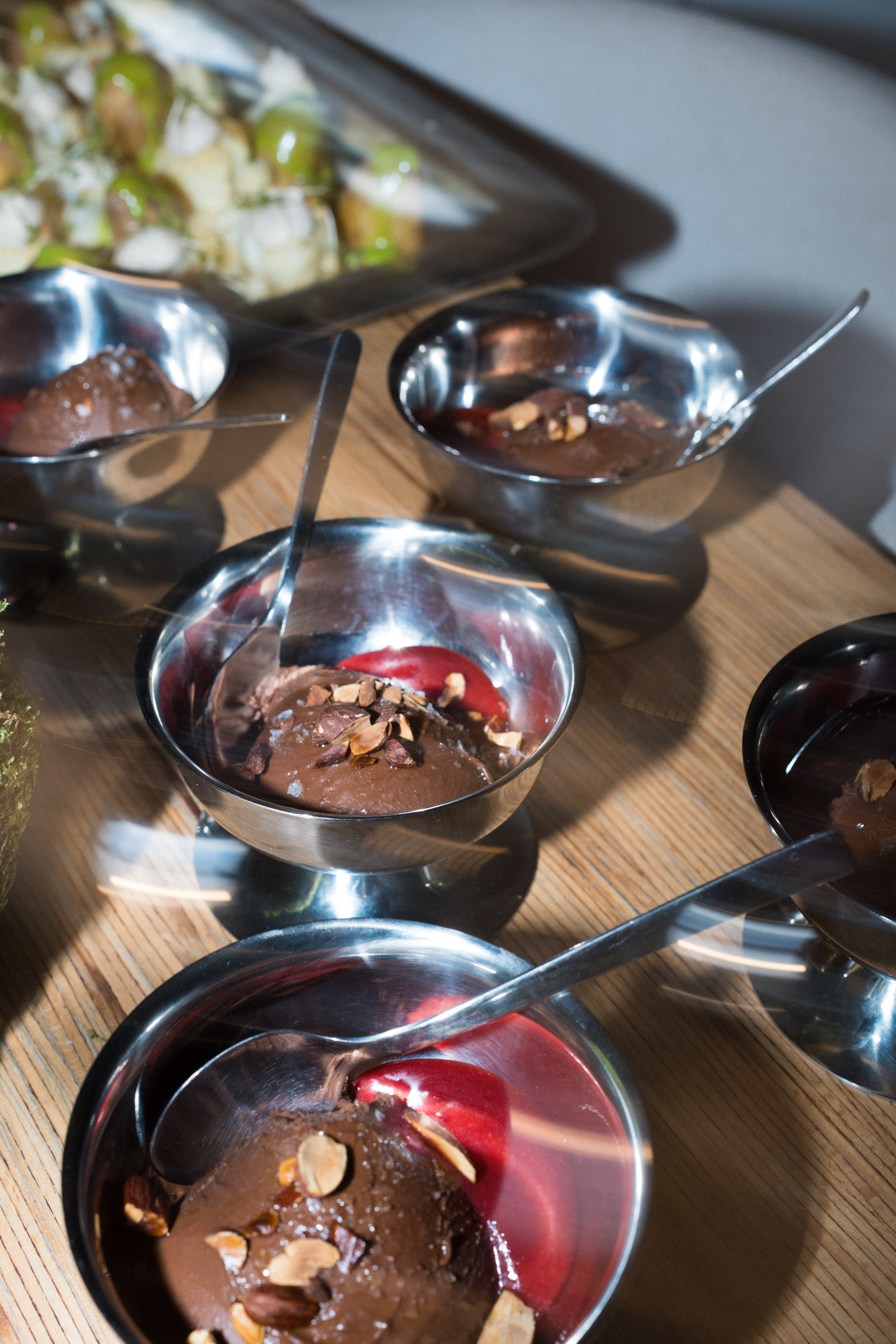 A group of people working and eating together outdoors.