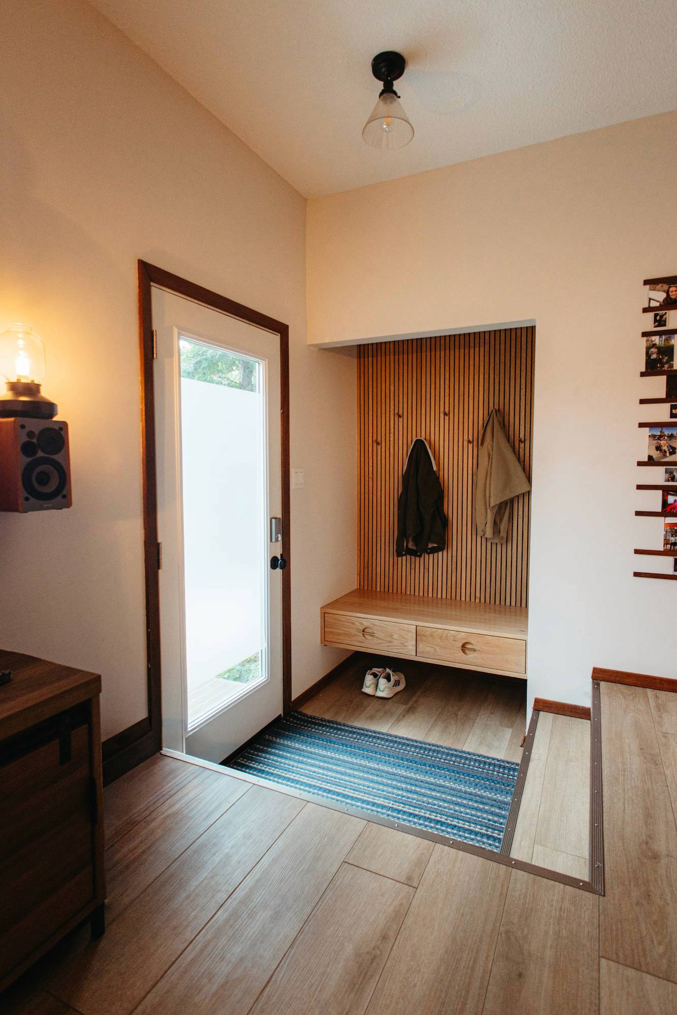 Home enterance with floating shelf and custom woodwork