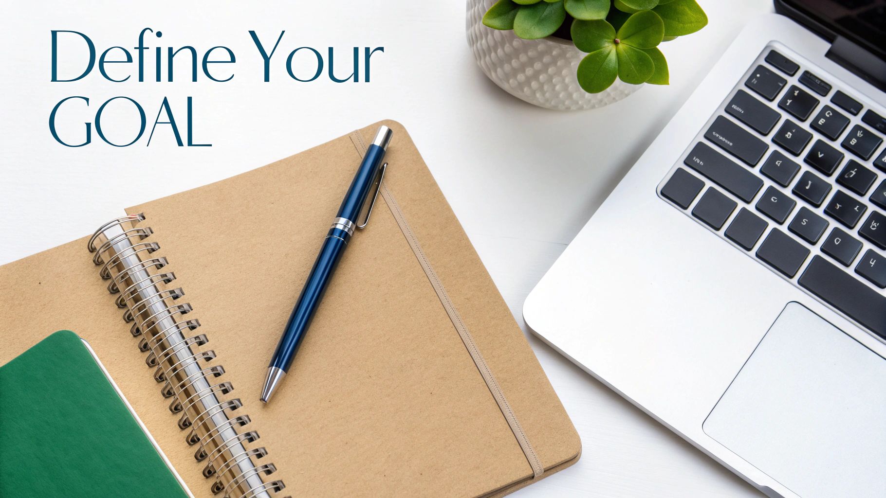 A person at a desk strategically planning on a laptop and with sticky notes, representing goal setting for a LinkedIn post