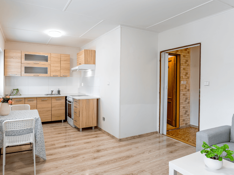 Newly painted open-plan kitchen and living space in Holland Park. Bright and minimalist with fresh paintwork by AUPaint.