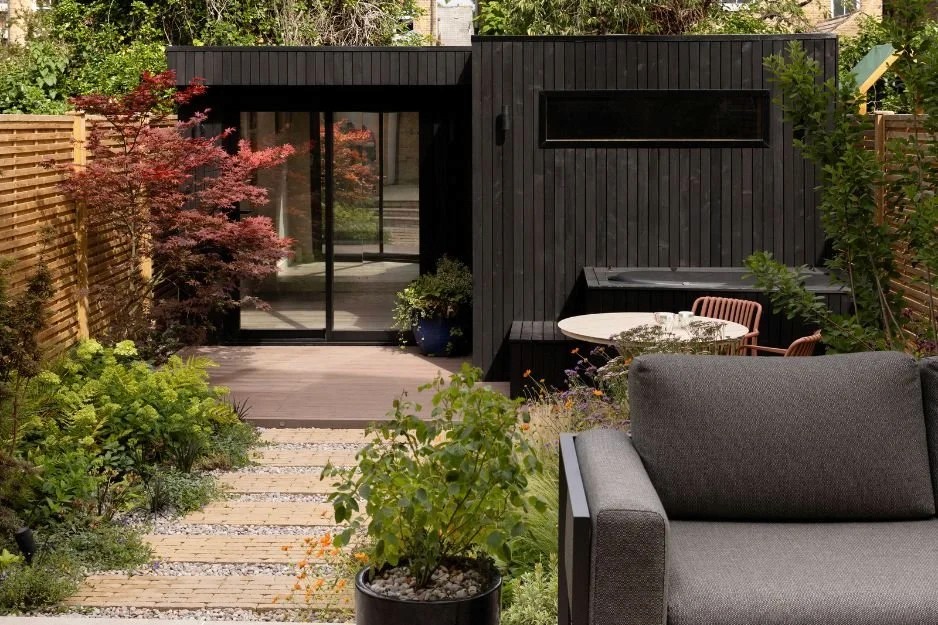 Brockley Wellness Room in Brockley. Burnt Siberian larch garden room with sauna by Eleven Trees.