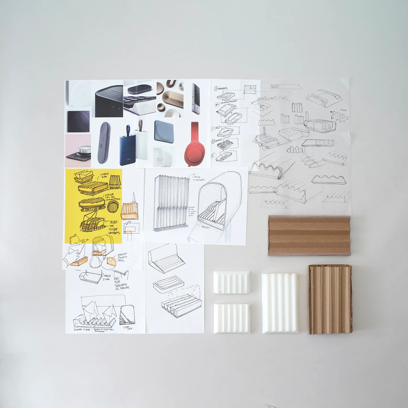 Industrial design sketches, material samples, and CMF studies arranged on a design board