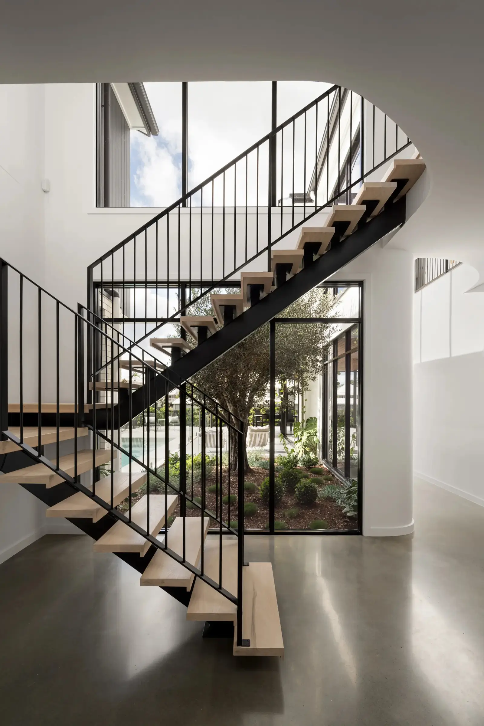 Double height voided staircase acting as a light filled focal point