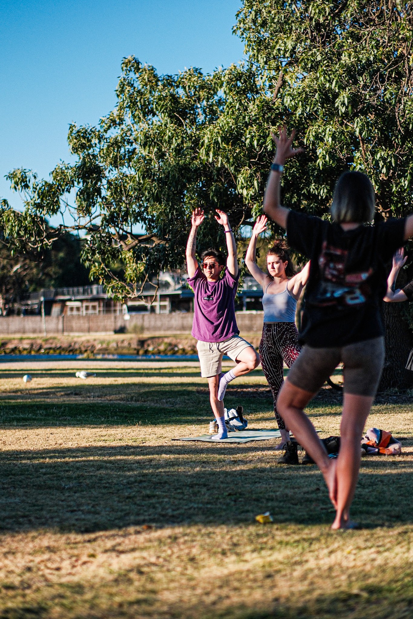 Commercial photography by JamesTheLyon for PixelSpaces — events, gigs, headshots, people, and architecture — park yoga namaste mindfulness grounded local community 