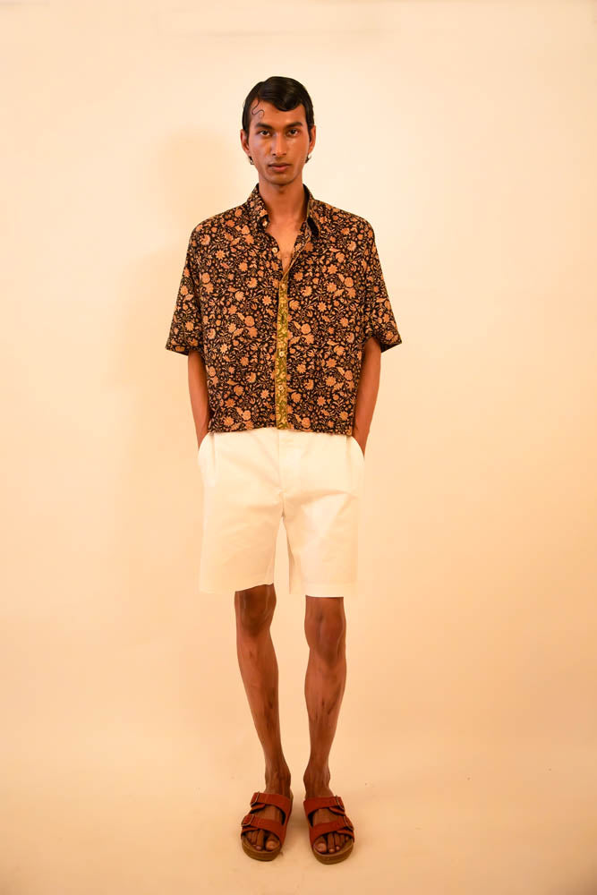 Cropped boxy silk shirt handcrafted from a vintage sari, featuring paisley print, delicate piping details, and a distinctive back panel created from the pallu, celebrating mindful craftsmanship