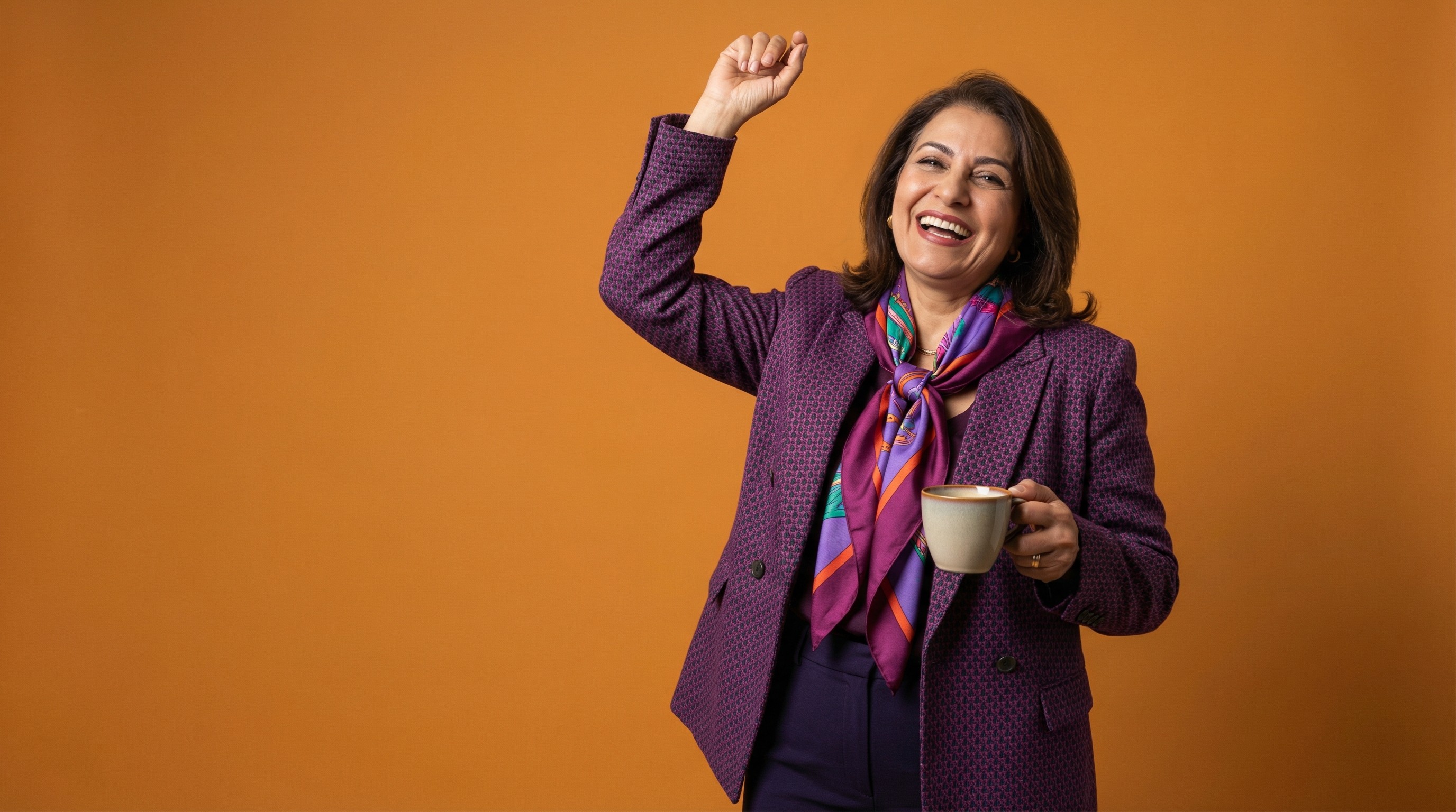 Close-up of lush, dark green leaves, some glossy and wet, against a muted background.