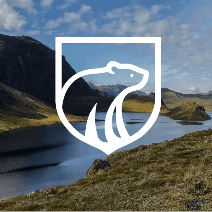 Greenland Energy polar bear mark over a Greenland landscape