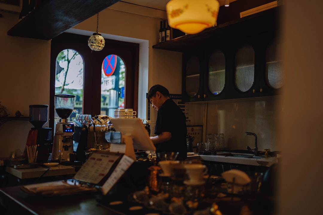 Barista preparing drinks behind a counter