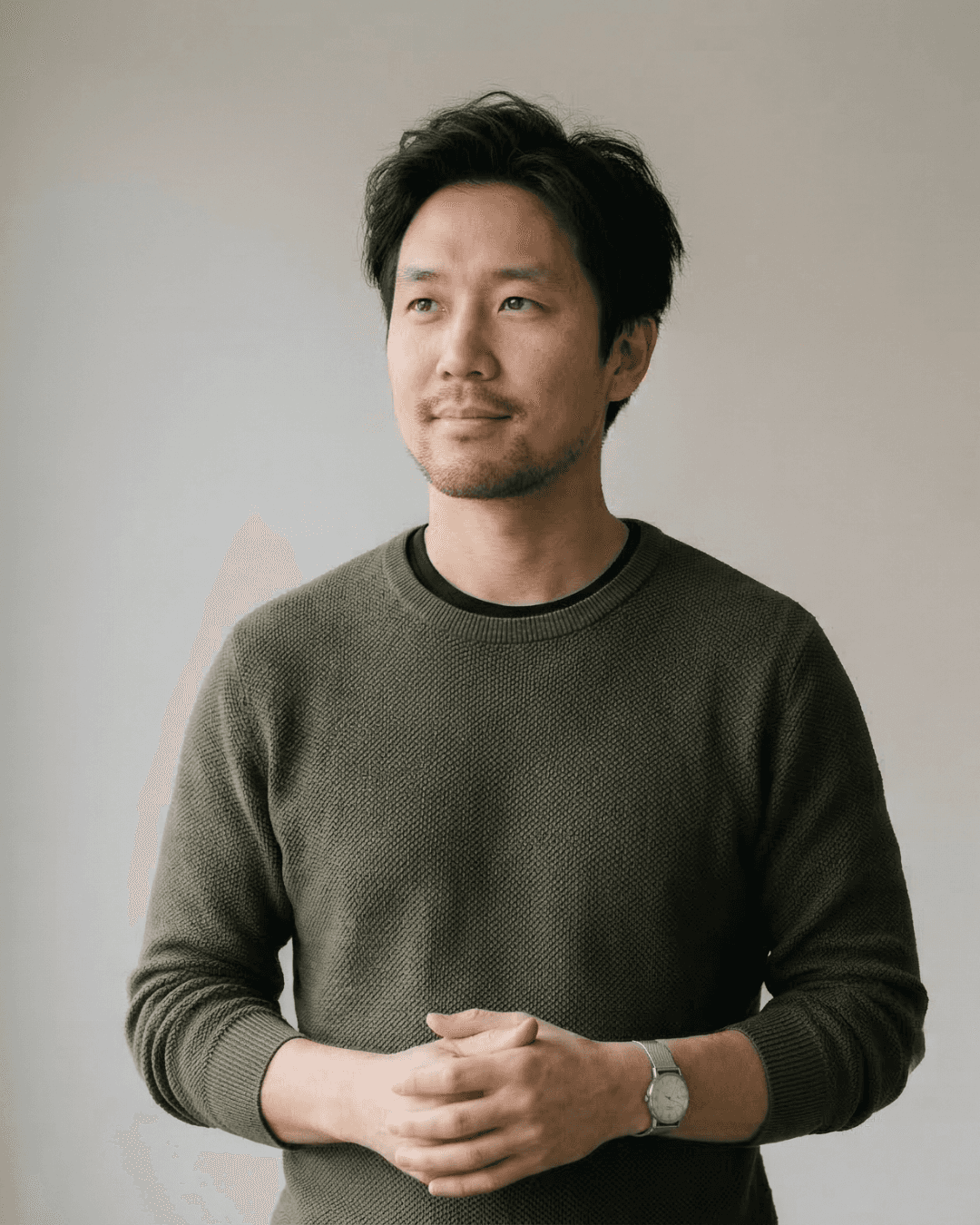 man in black hoodie standing