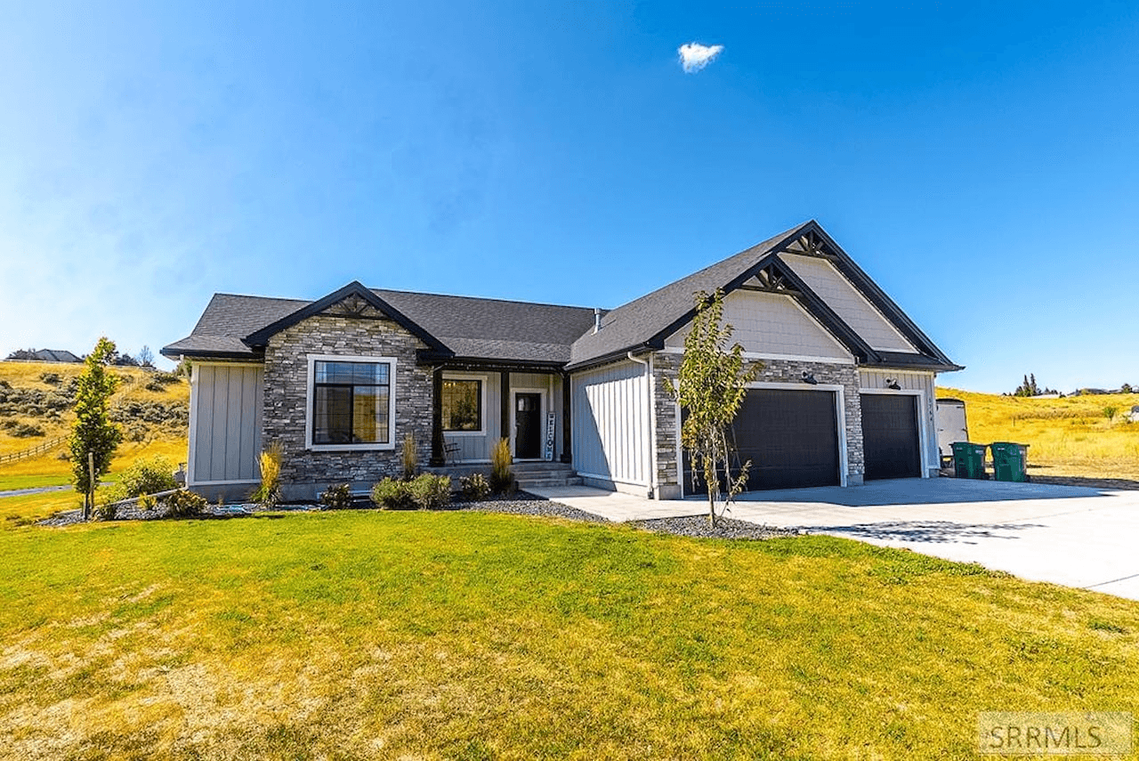 Modern ranch home with stone and siding exterior.
