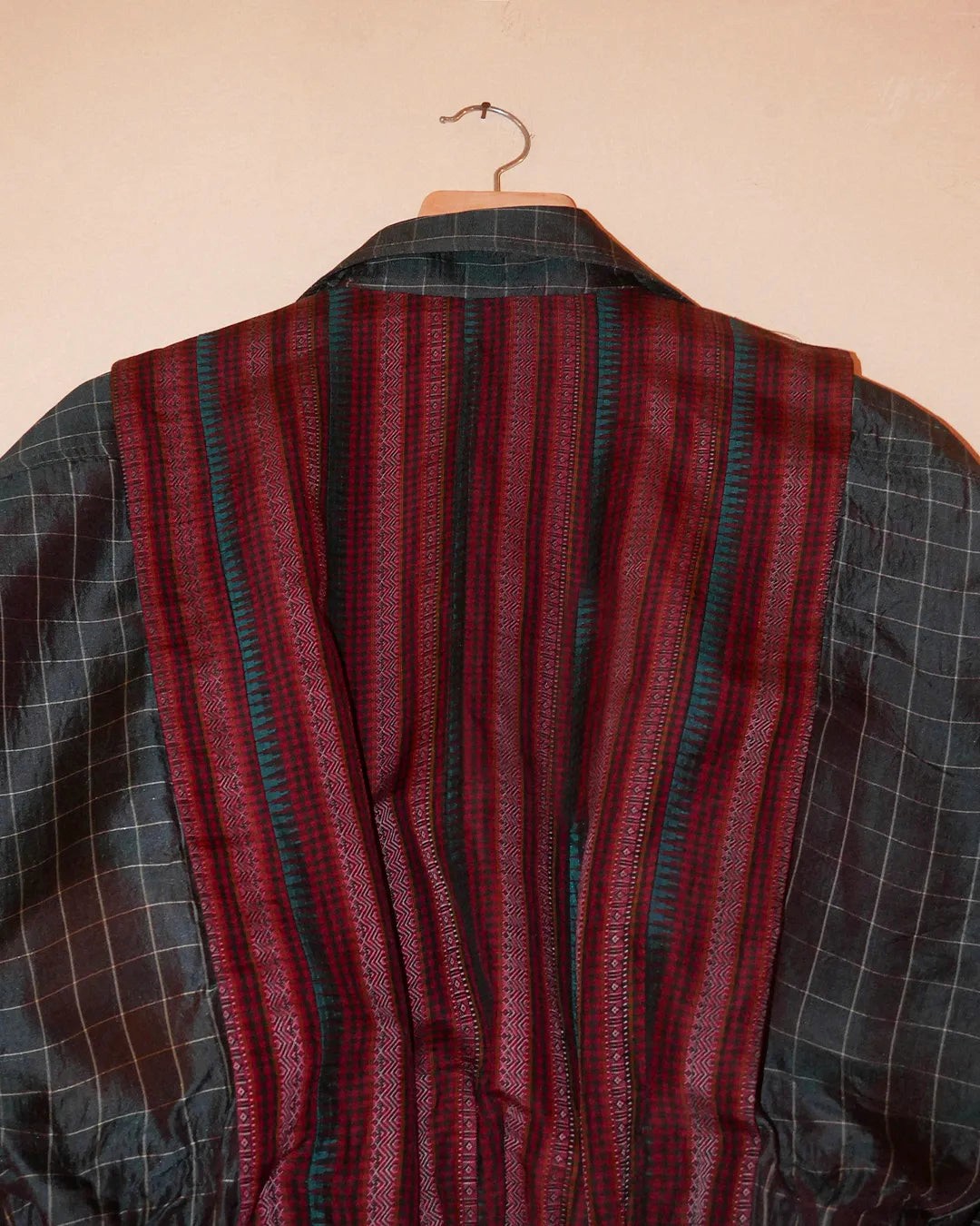 AMBR is our one-of-a-kind cropped two-toned silk brocade reversible bomber, handcrafted by skilled artisans in-house using two vintage silk saris.