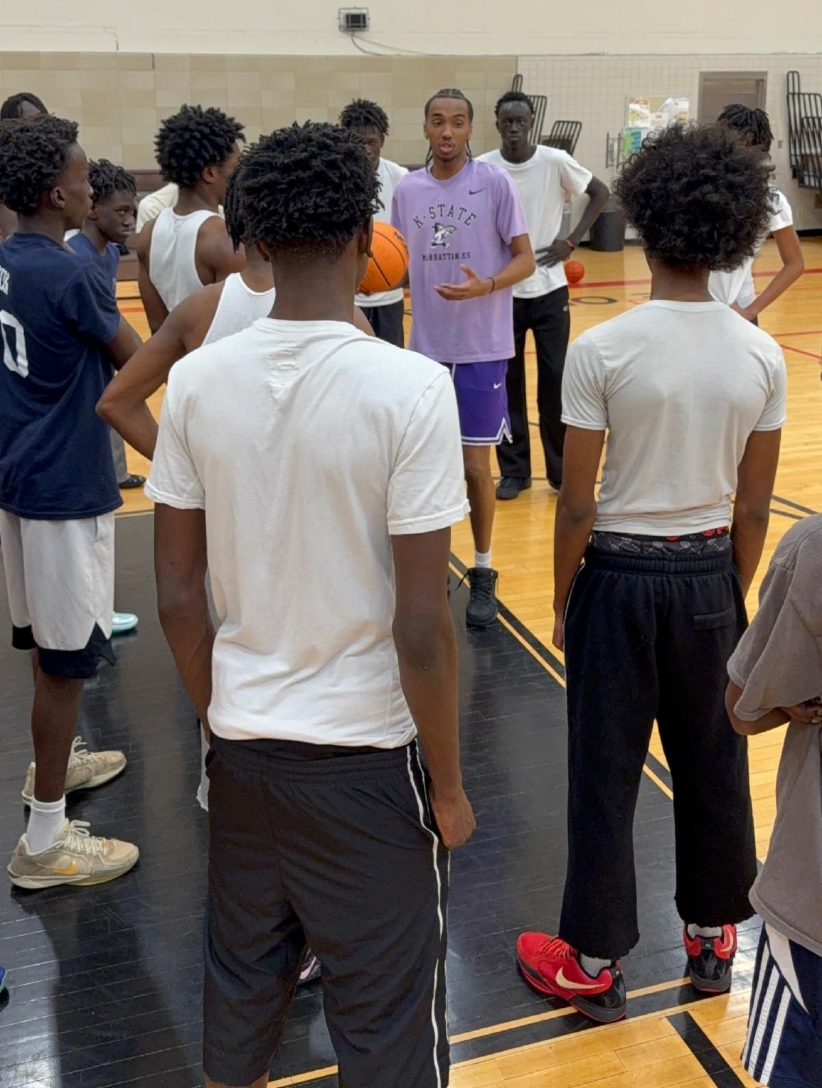ROSS Leaders alumnus Abdi Bashir with student athletes
