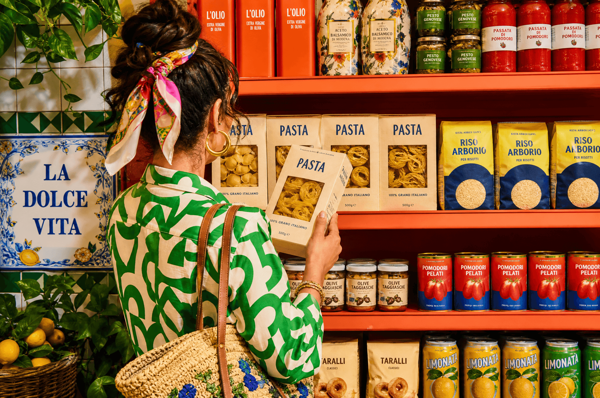A shopper browsing an Italian grocery aisle