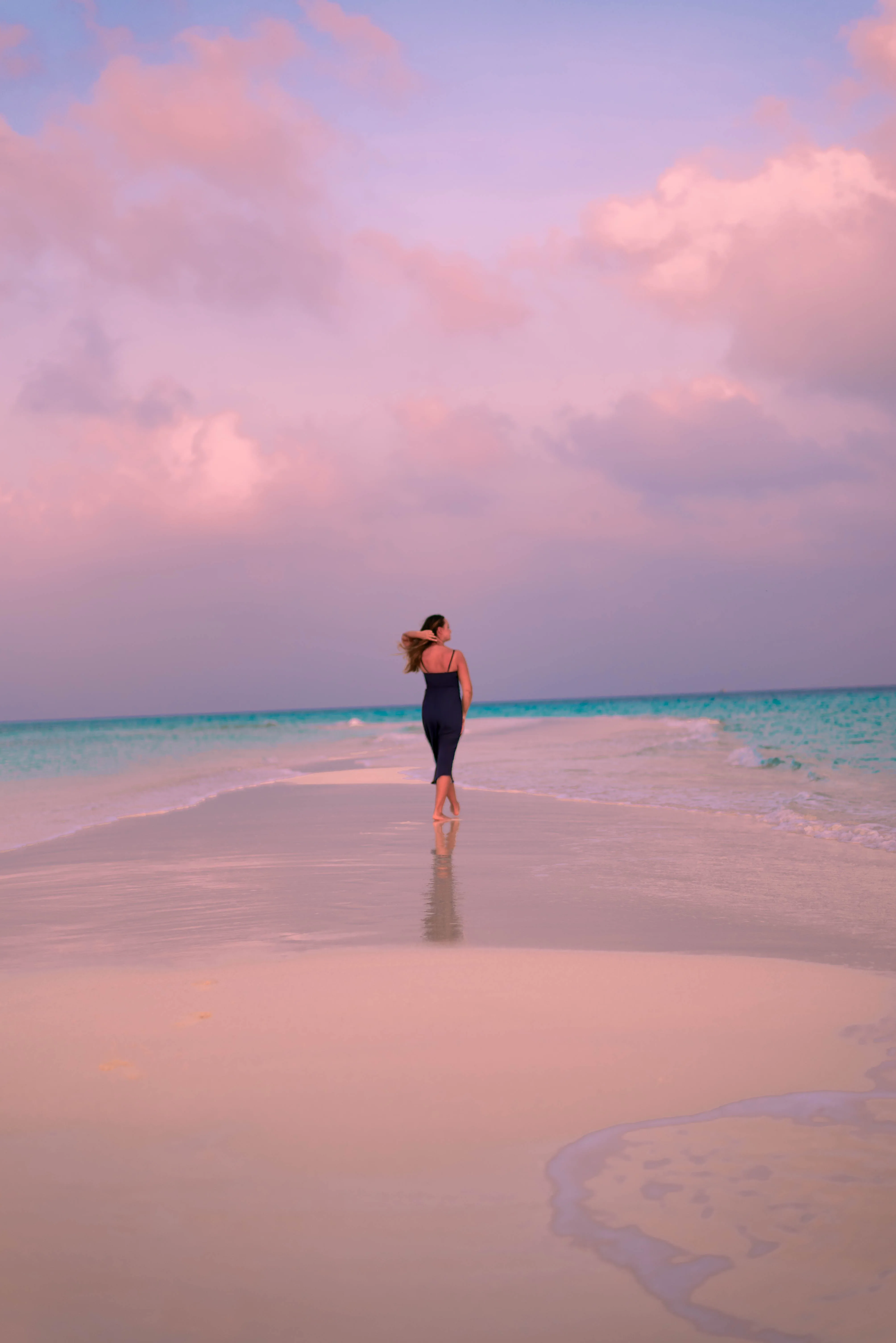 selective focus photo of man standing holding DSLR camera