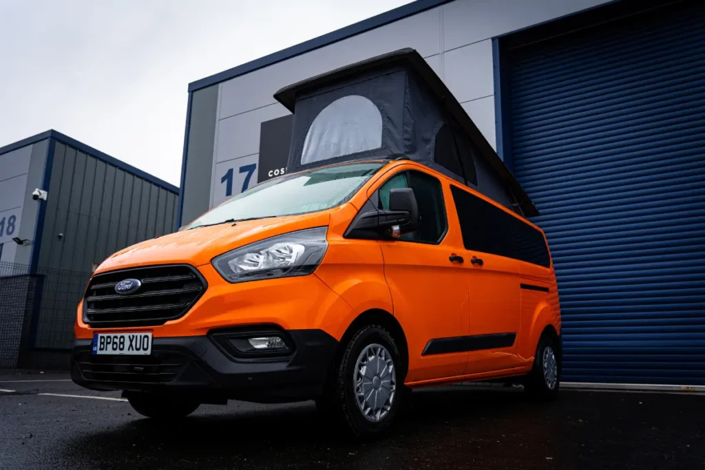 Orange Ford Transit Custom Conversion with pop top