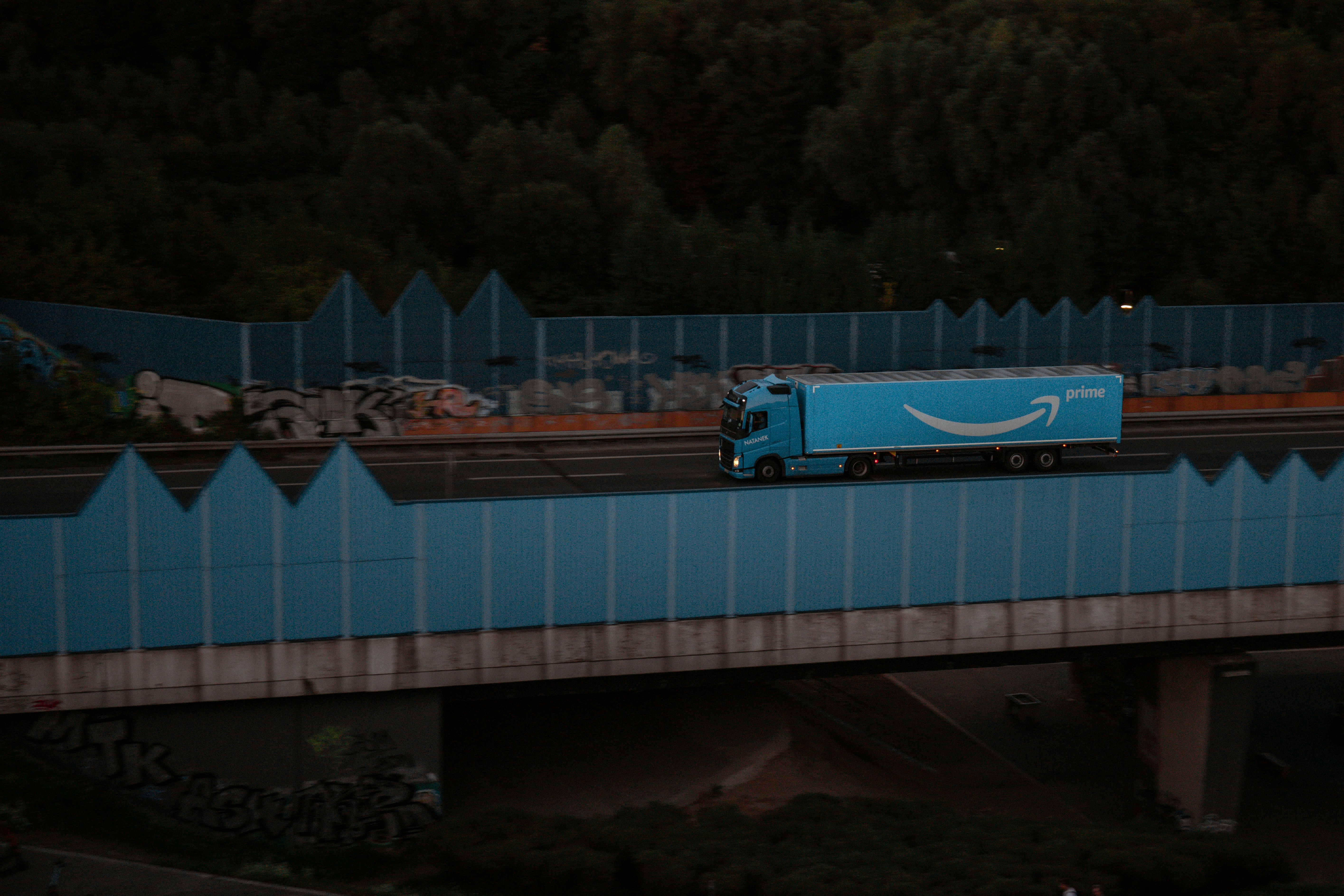 Amazon freight truck crosses a large bridge