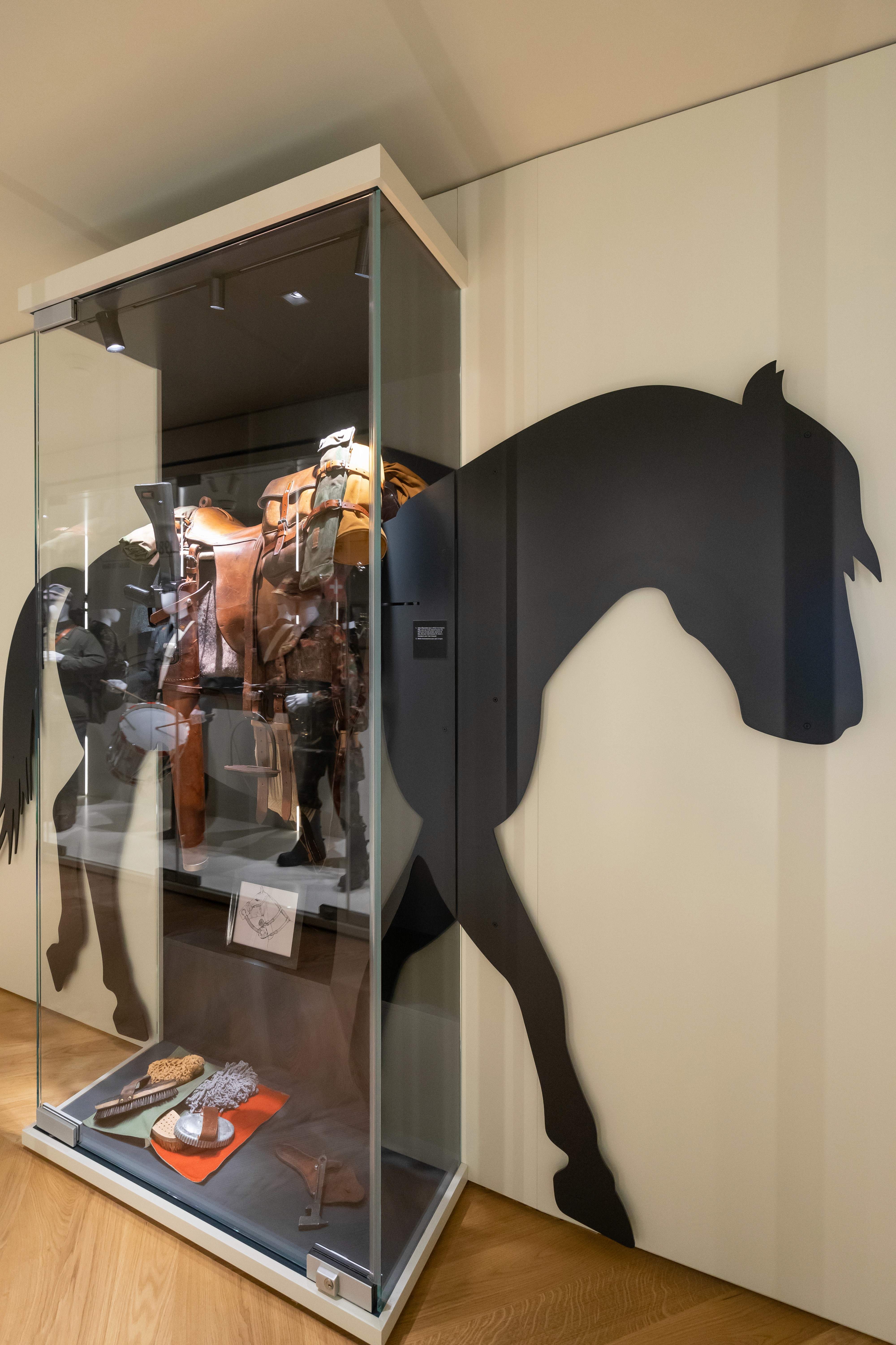 Horse saddle display showcase   in an exhibition design concept of a museum retail for Switzerland 