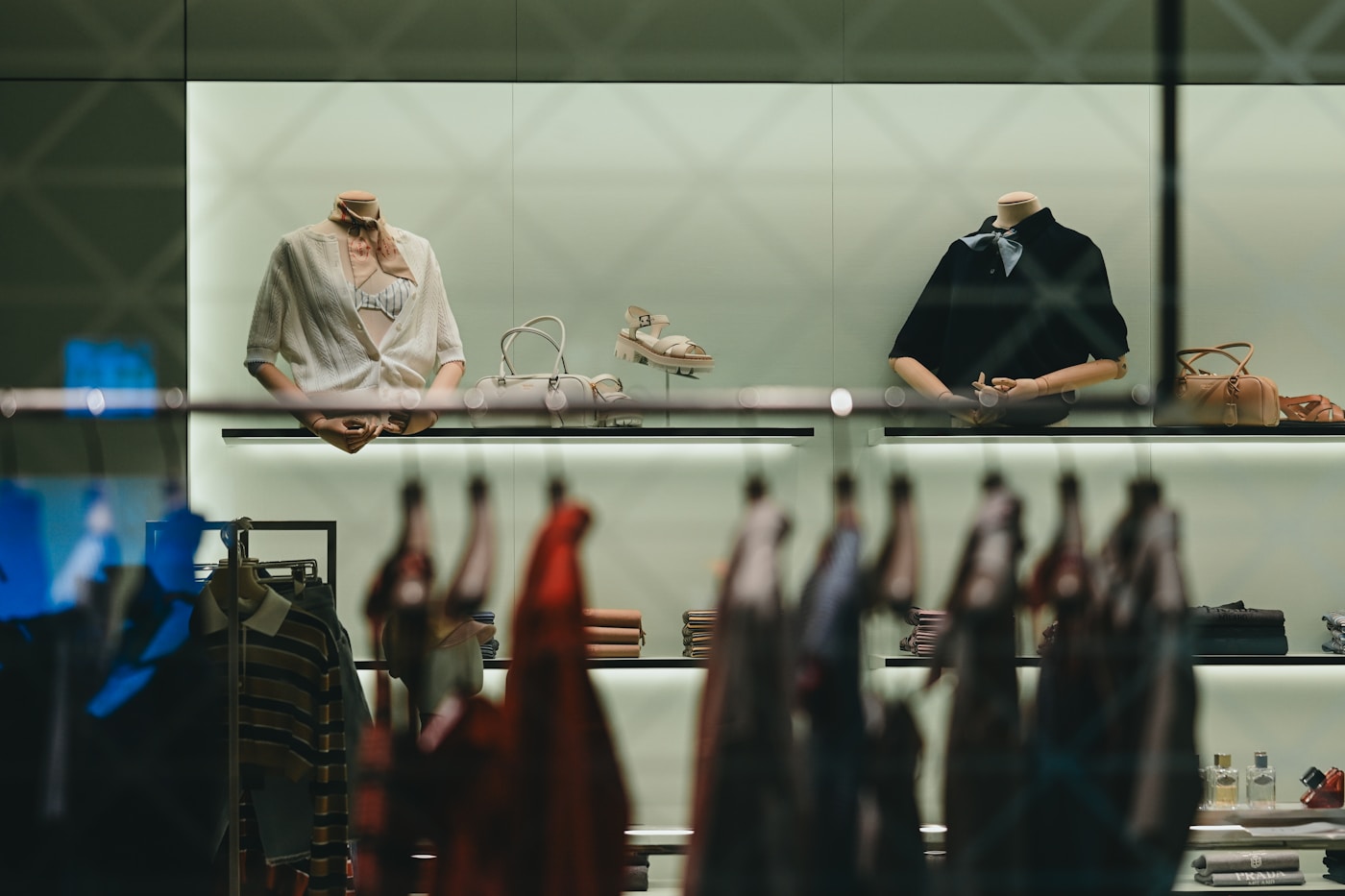 Fashion garments and accessories displayed in a modern retail store