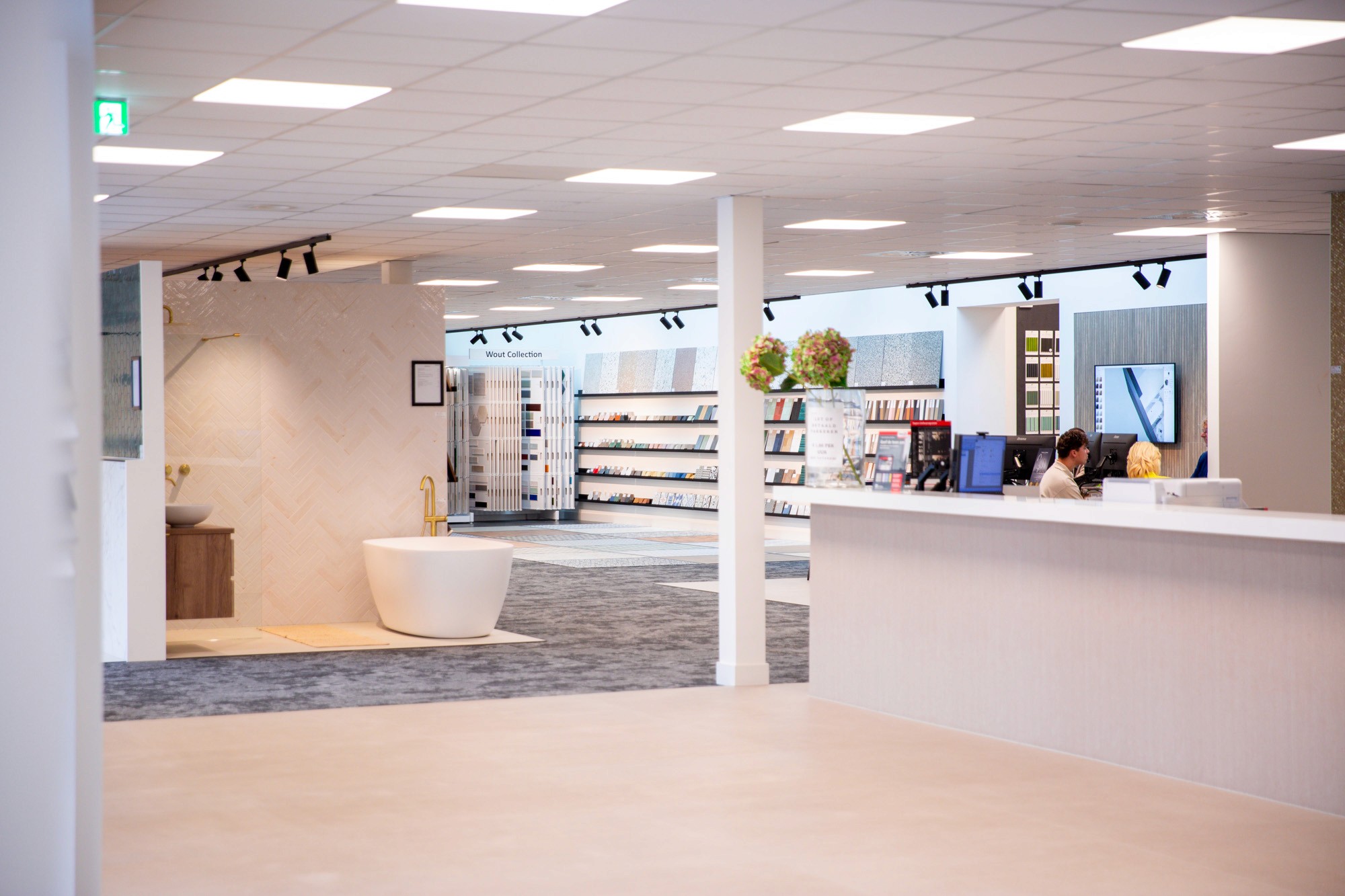 Exterior of a building with orange awnings and a sign above the door that reads “Prospect.”