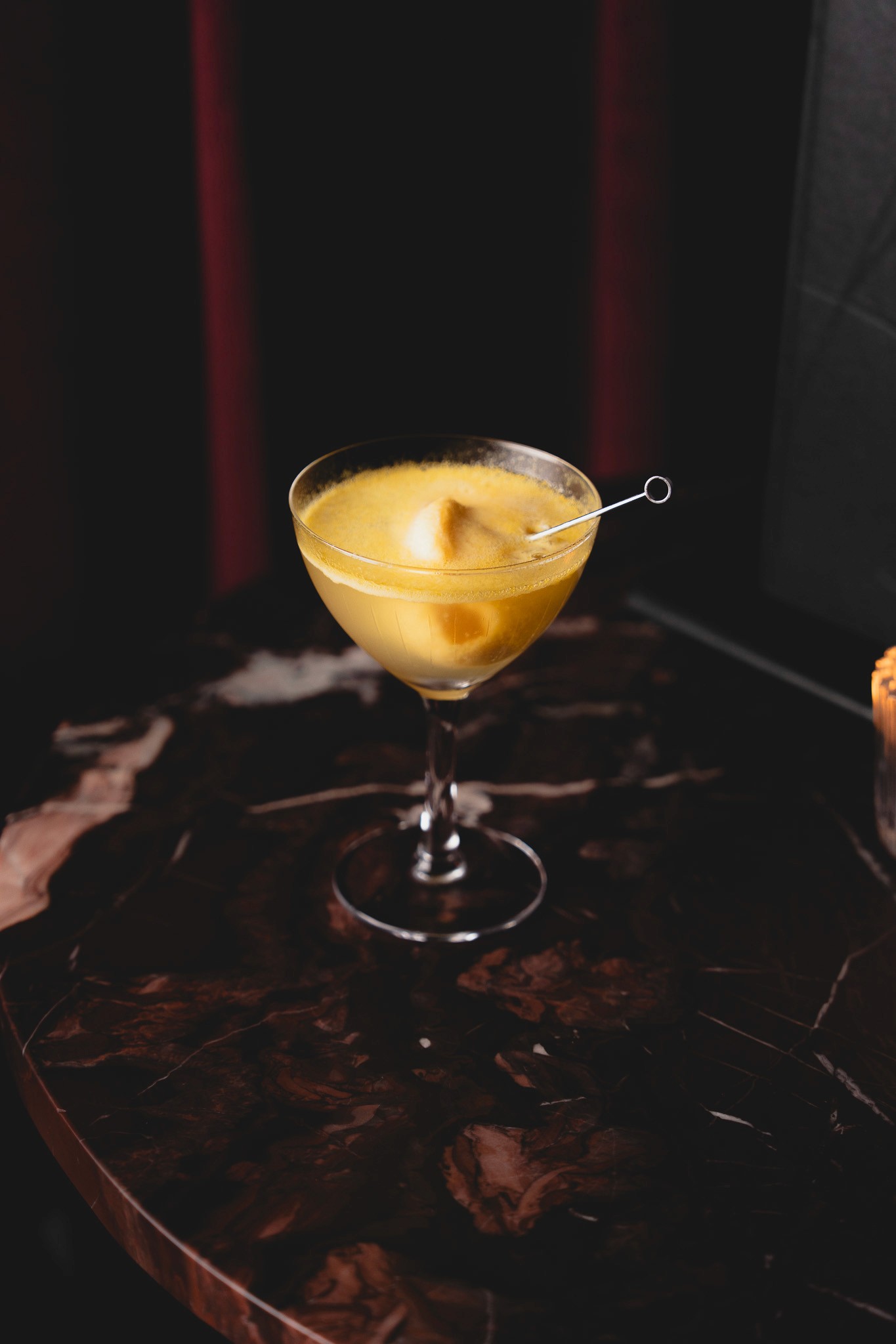 Bottles of olive standing on the marble counter