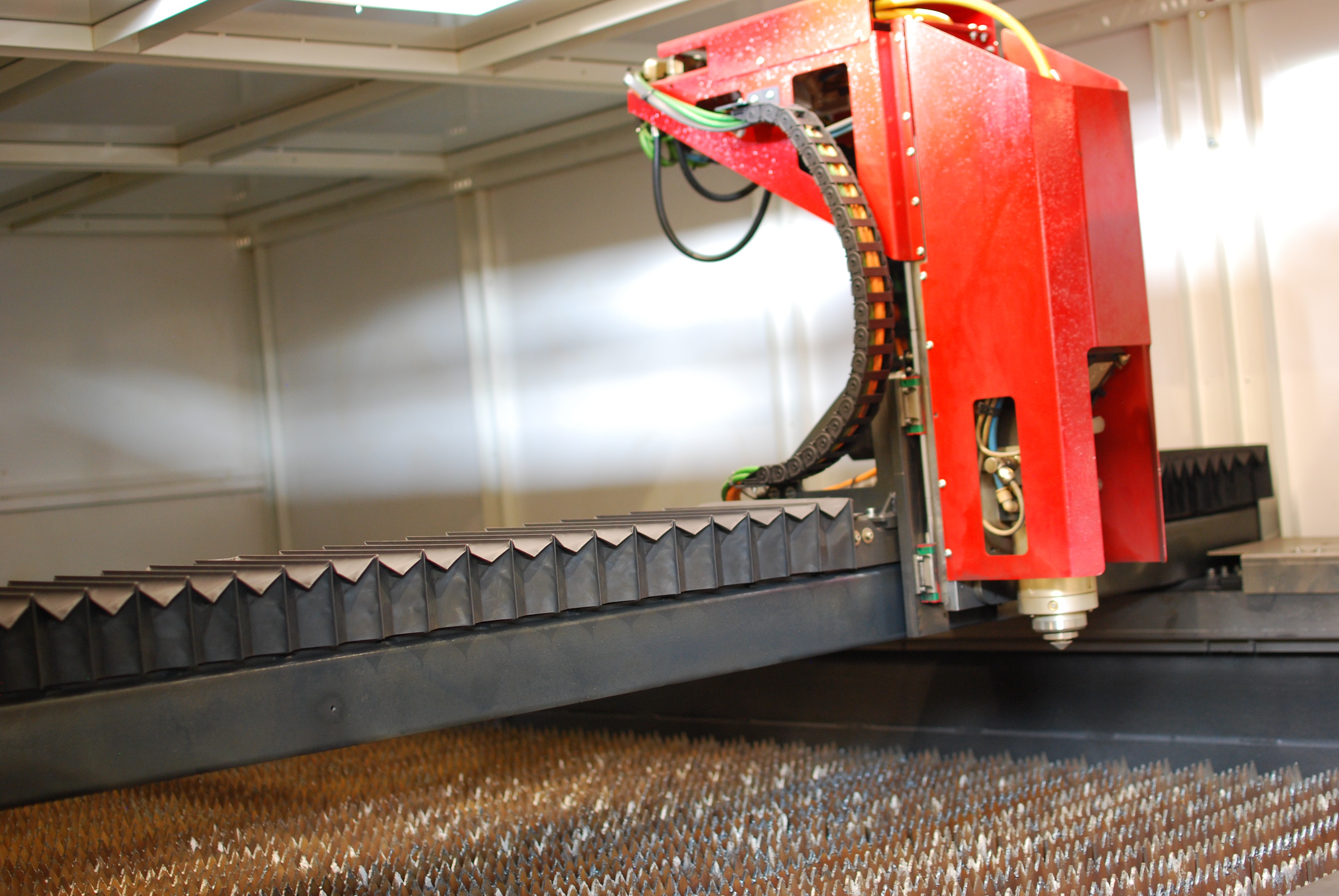 a man welding a piece of metal in the dark