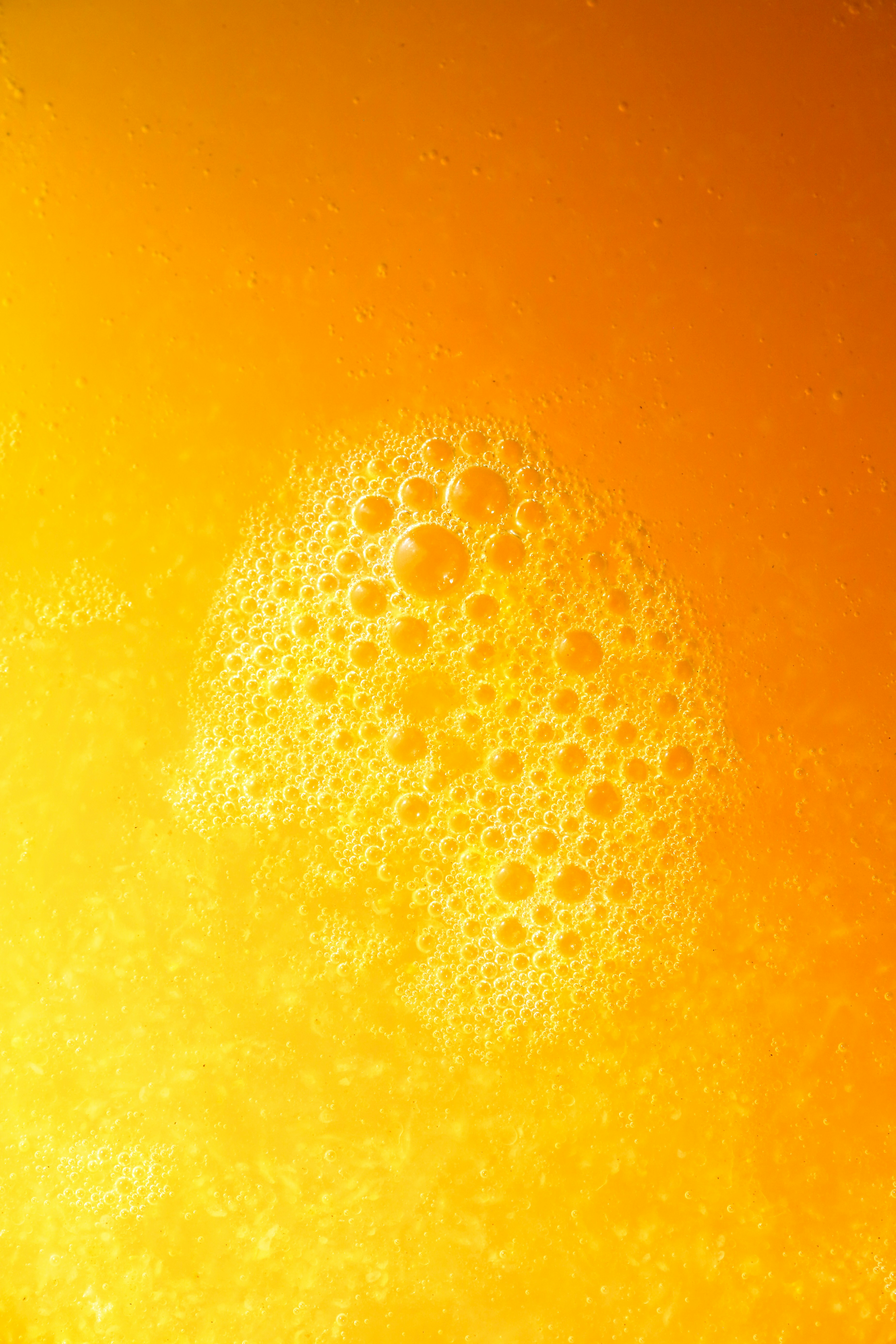Orange juice with bubbles.