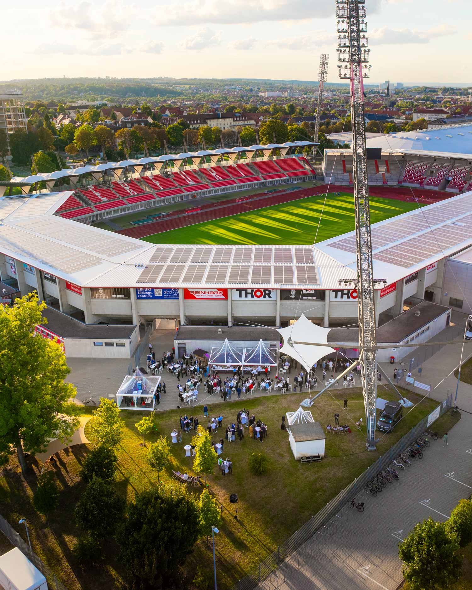 Aerial view of a stadium with an outdoor event, showcasing strategic film production and storytelling for a brand campaign.