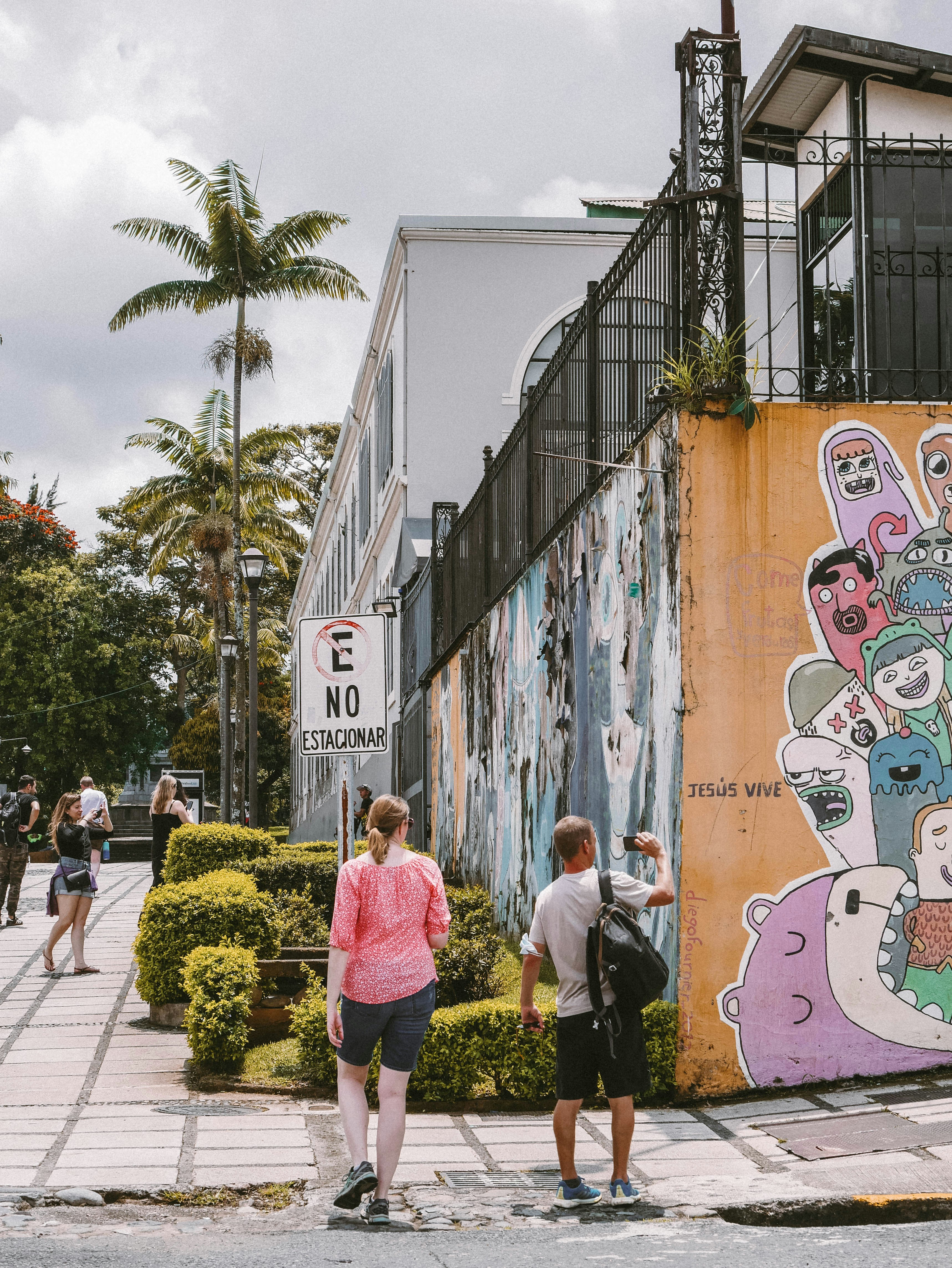 people walking on a sidewalk